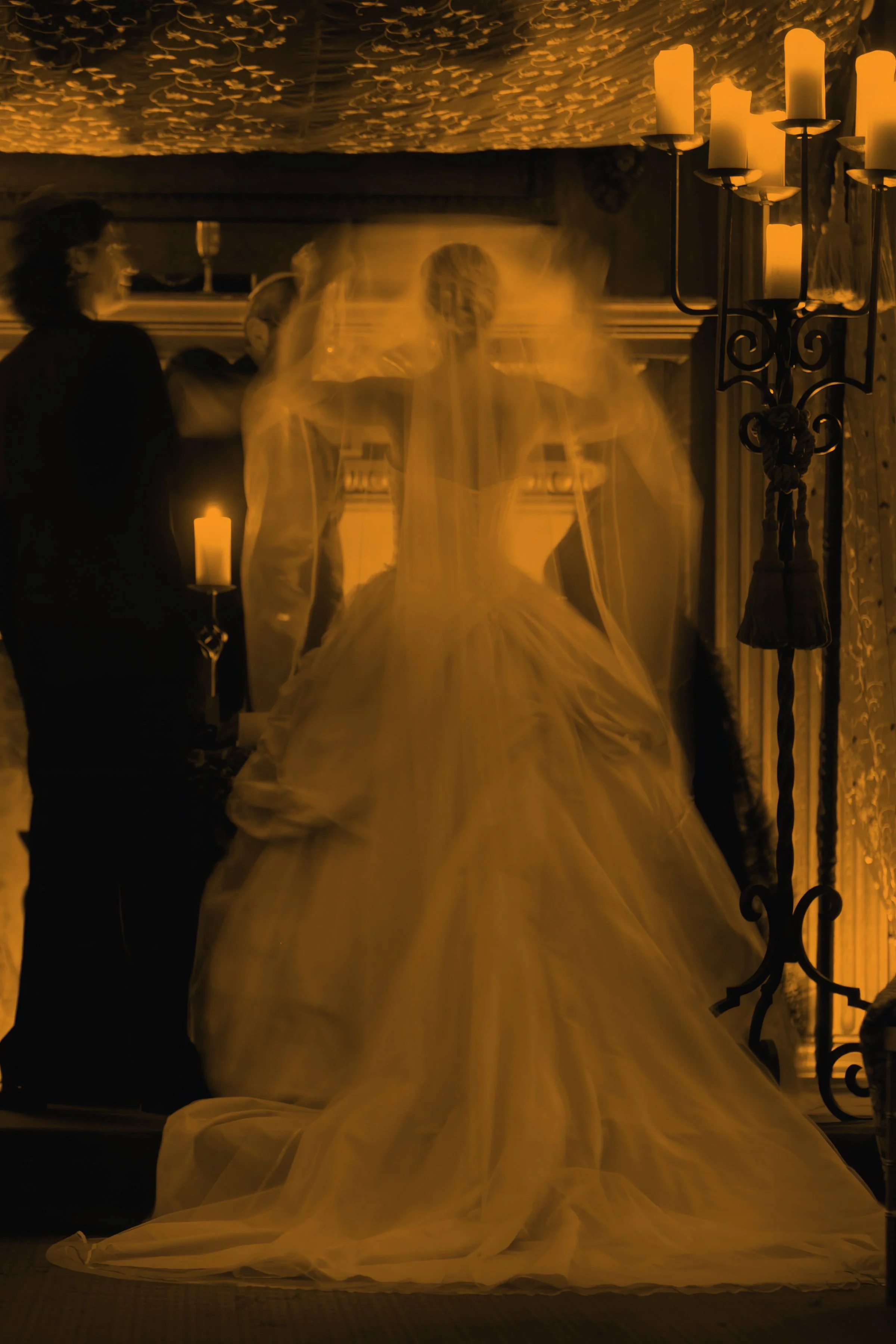A fine art moment as the bride's veil is lifted during a wedding ceremony at The Harmonie Club NYC