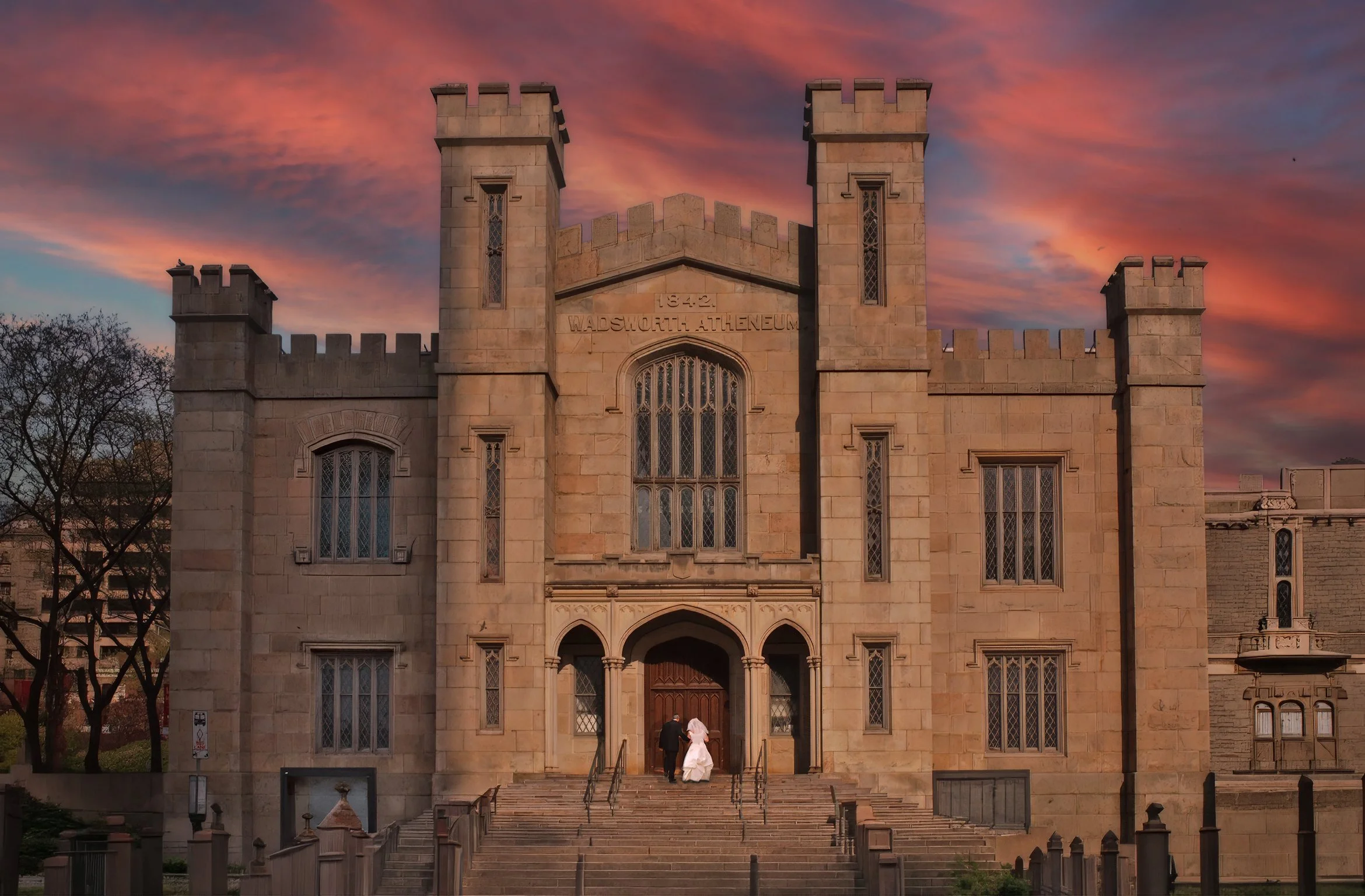 Bride and groom entering Wadsworth Atheneum museum during wedding in Hartford Connecticut