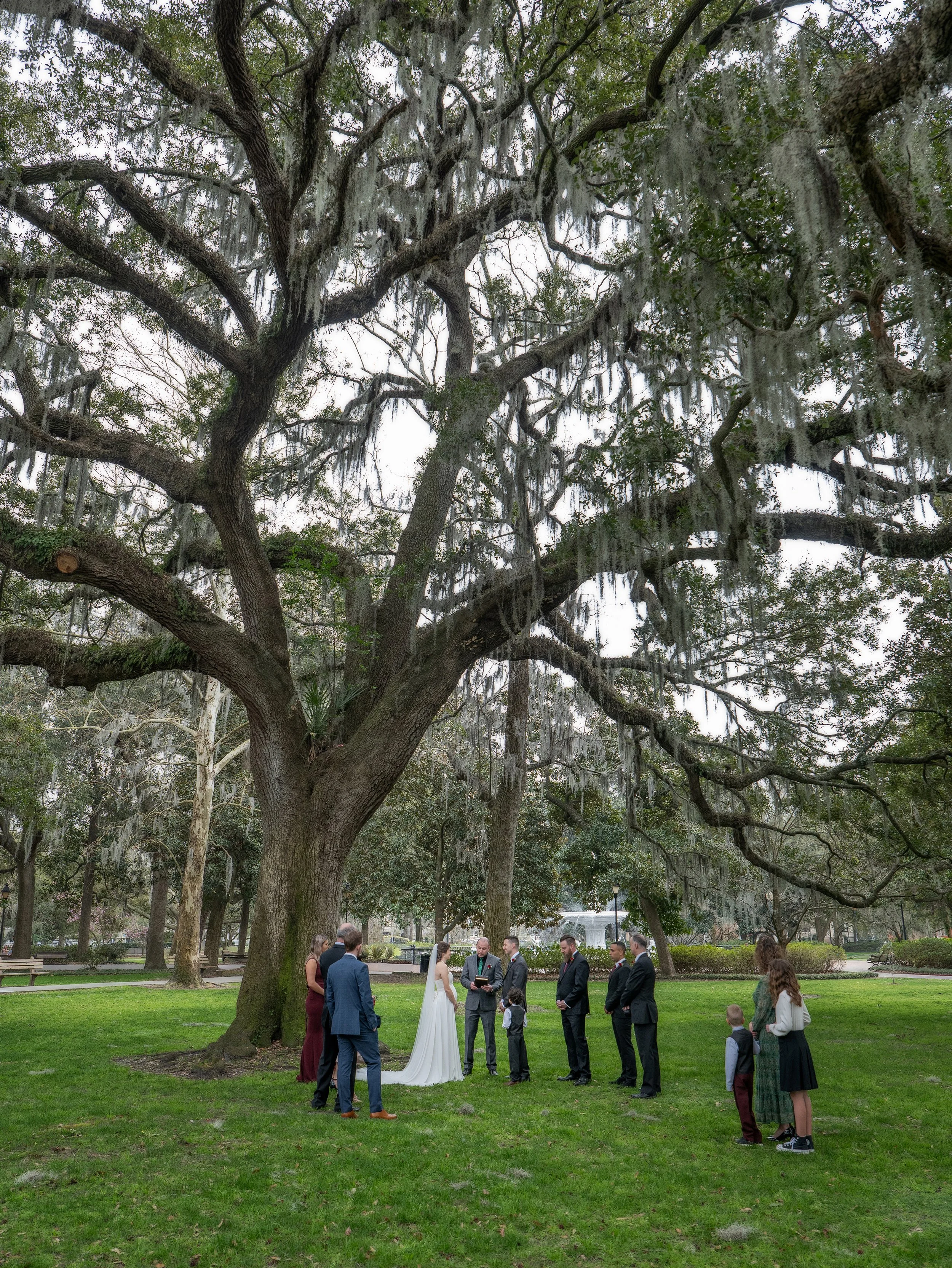 Tim and Daniella exchange vows with close family and friends gathered beneath the live oaks of Forsyth Park in Savannah.