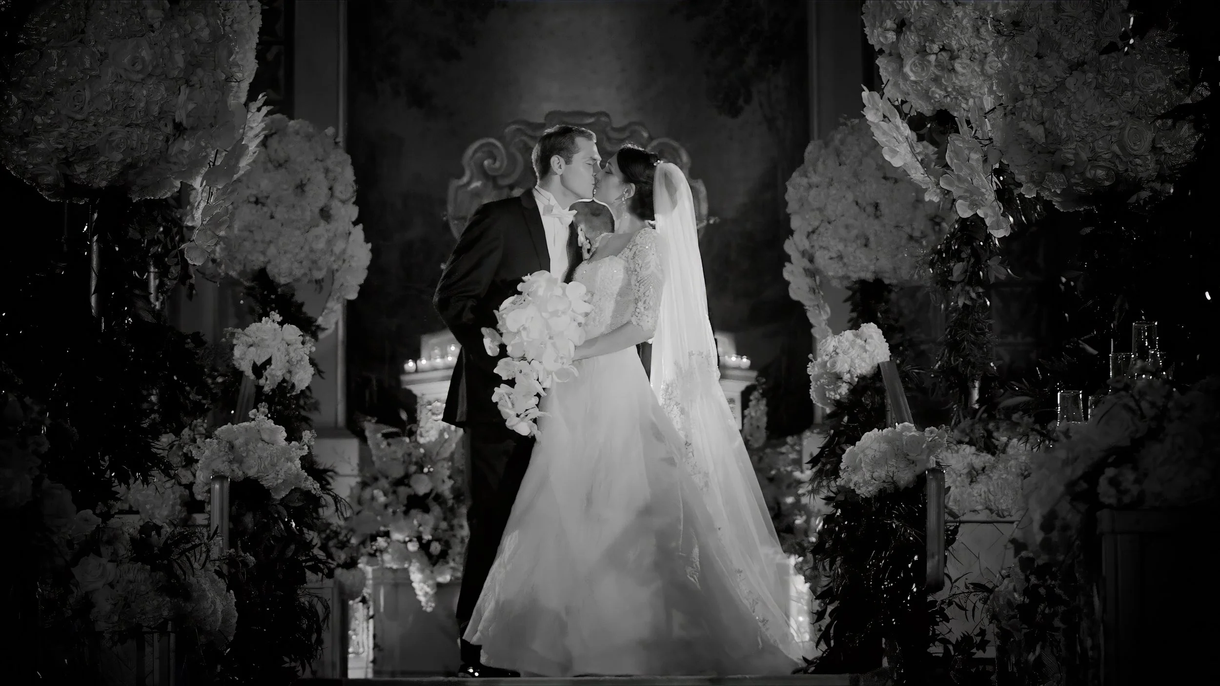 Bride and groom kiss in the Terrace Room at The Plaza Hotel NYC during an elegant New York City wedding.