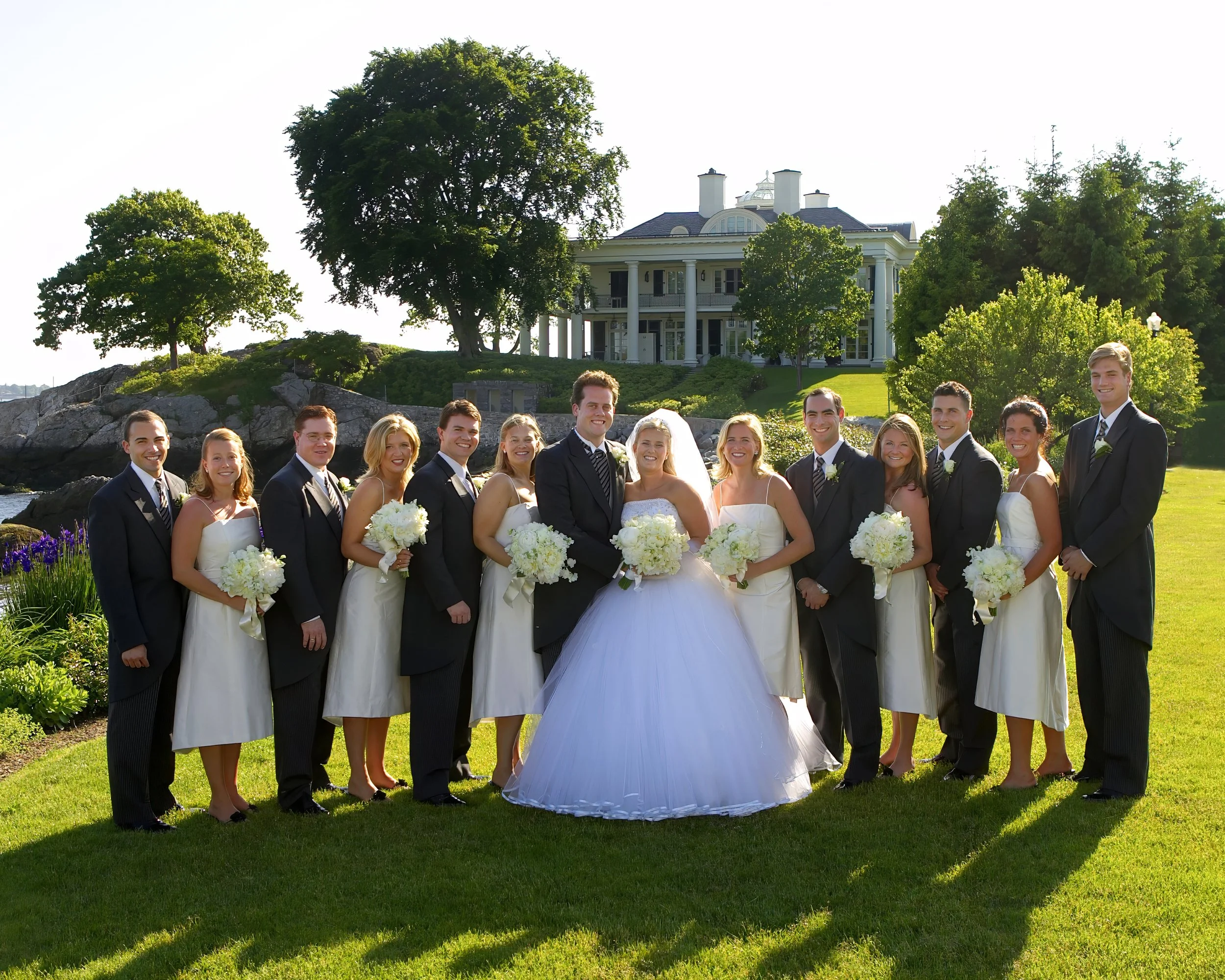 Bridal party portrait on the grounds of Belle Haven Yacht Club overlooking the harbor.