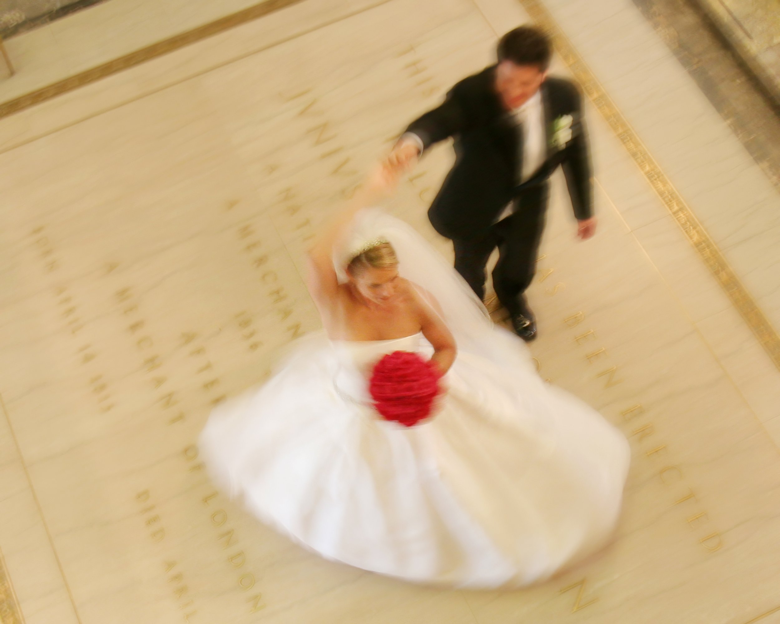 Bride and groom spin together on the dance floor at Wadsworth Atheneum