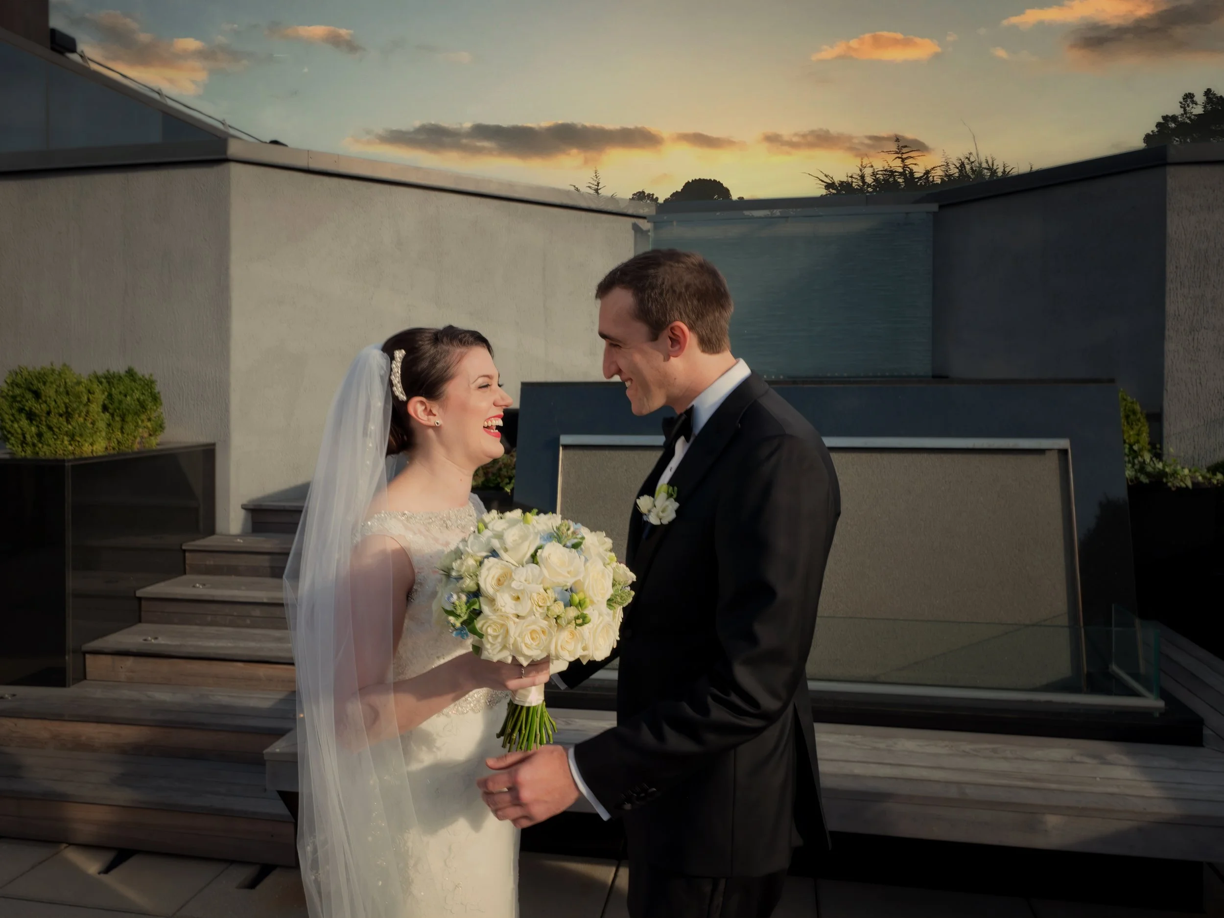 Bride and groom first look on the rooftop terrace of Lotte New York Palace Hotel with skyline view
