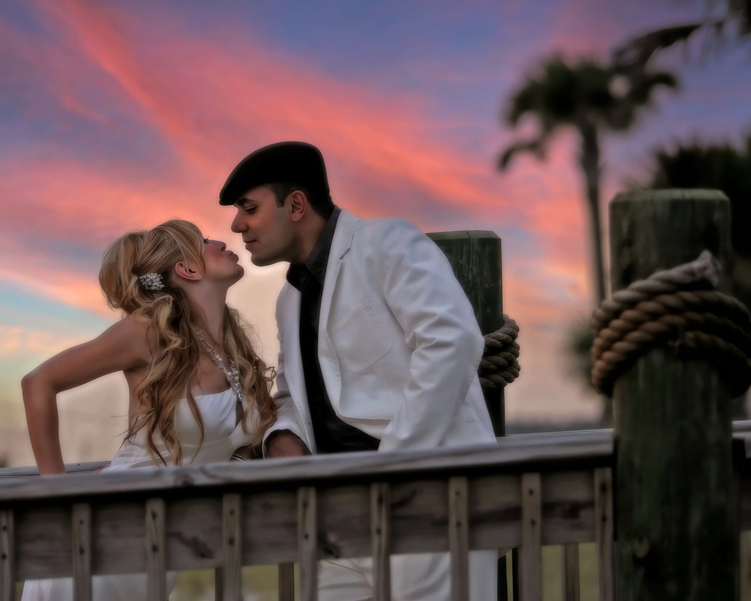 Bride and groom leaning in for a kiss in a dreamy photograph at the Ritz-Carlton Sarasota, Florida.