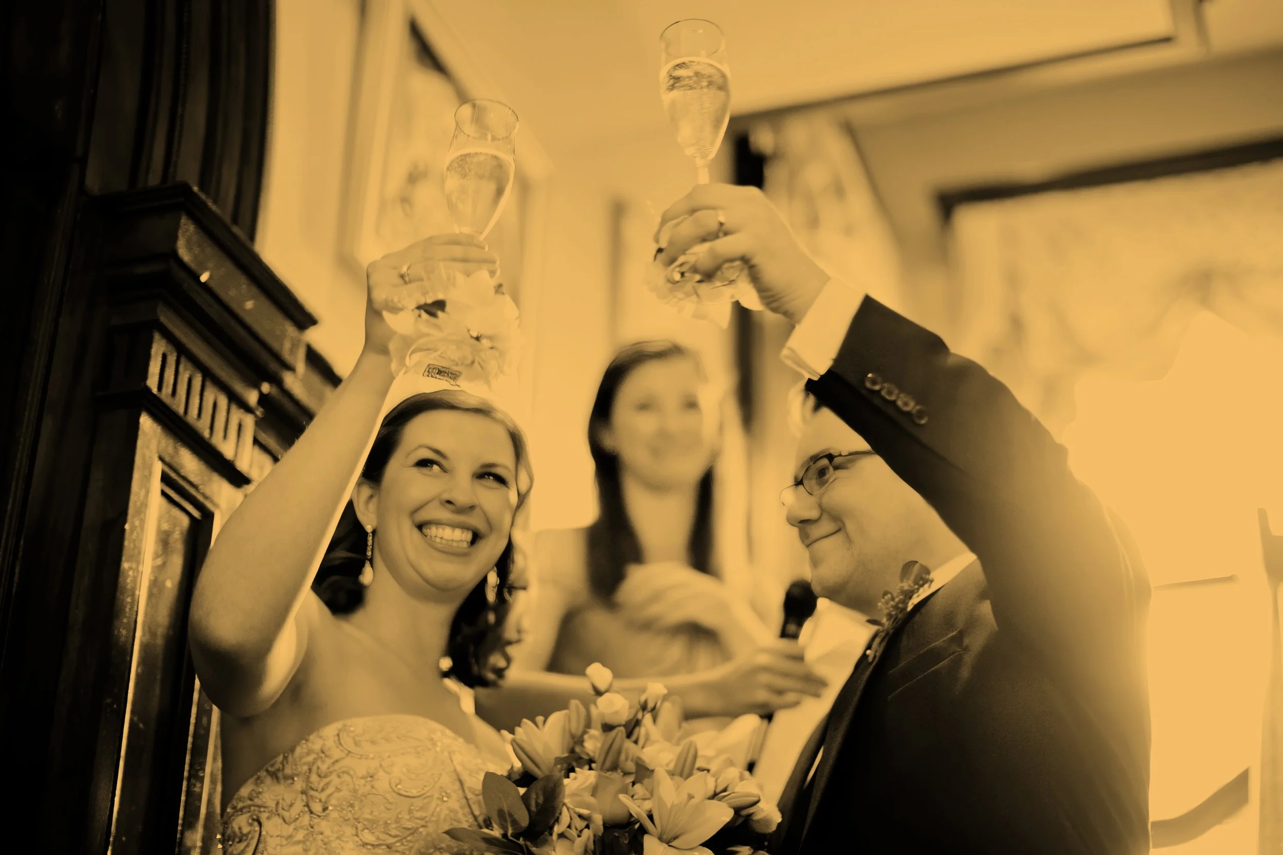 Bride and groom raising a glass during wedding reception at Union League Cafe New Haven Connecticut