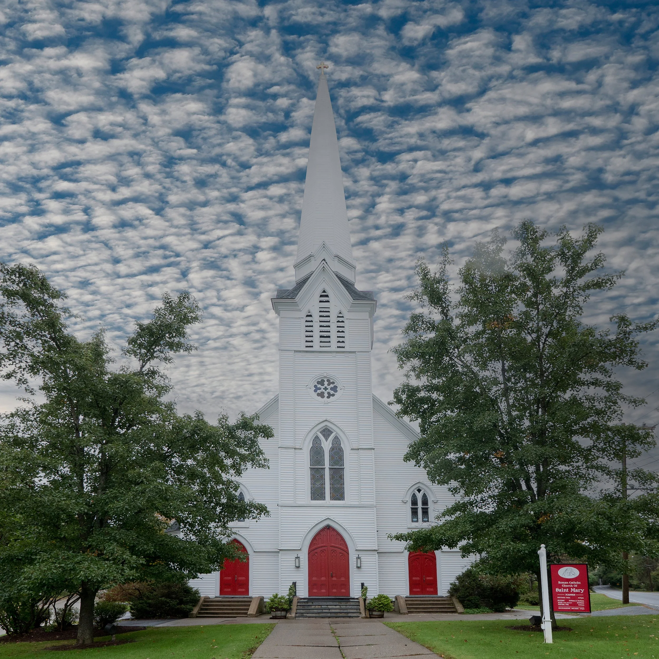 Exterior of Saint Mary’s Church in Sharon Connecticut surrounded by classic New England countryside.