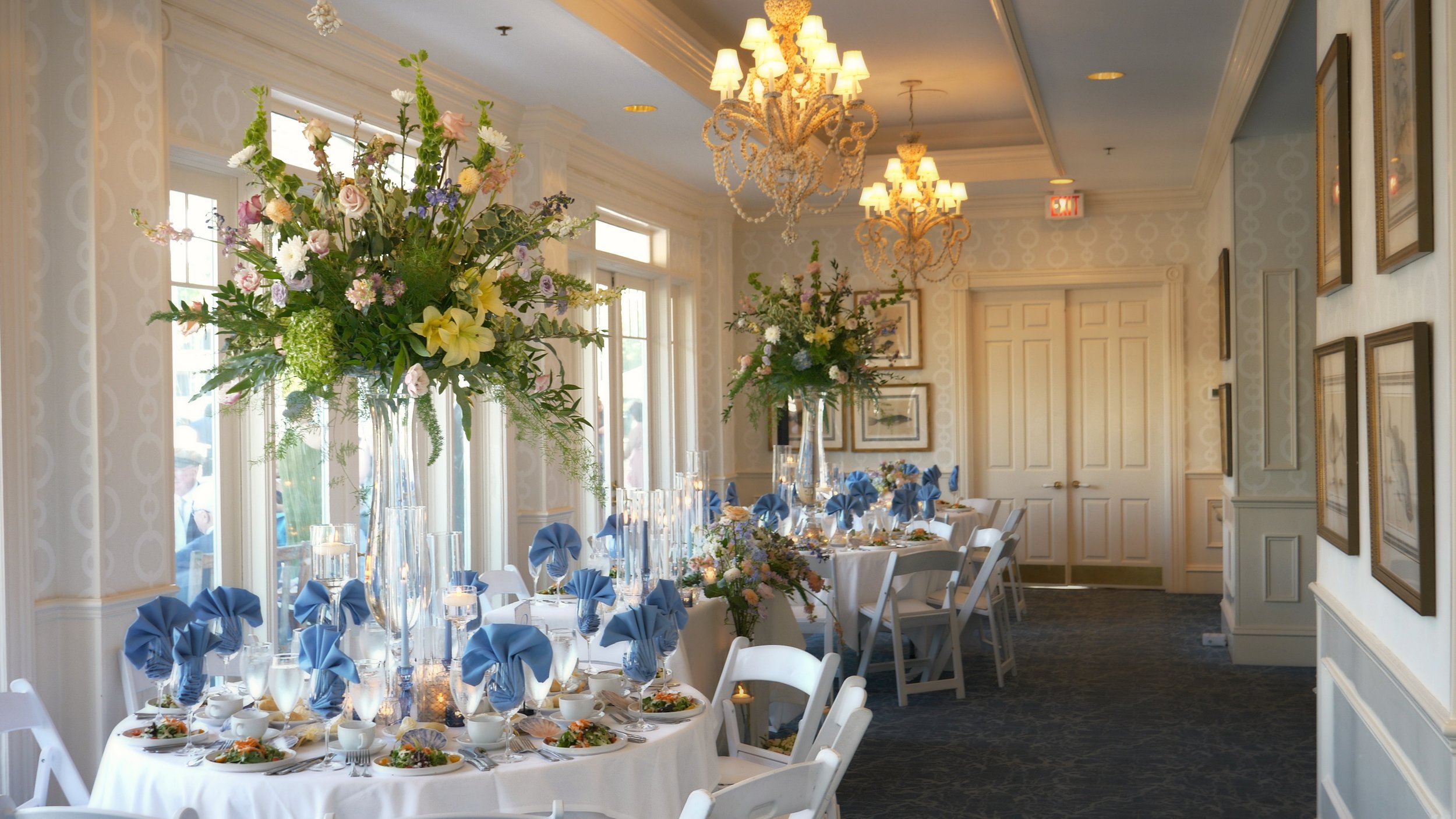 Tall floral centerpieces in soft natural light at South Carolina Yacht Club wedding reception Hilton Head