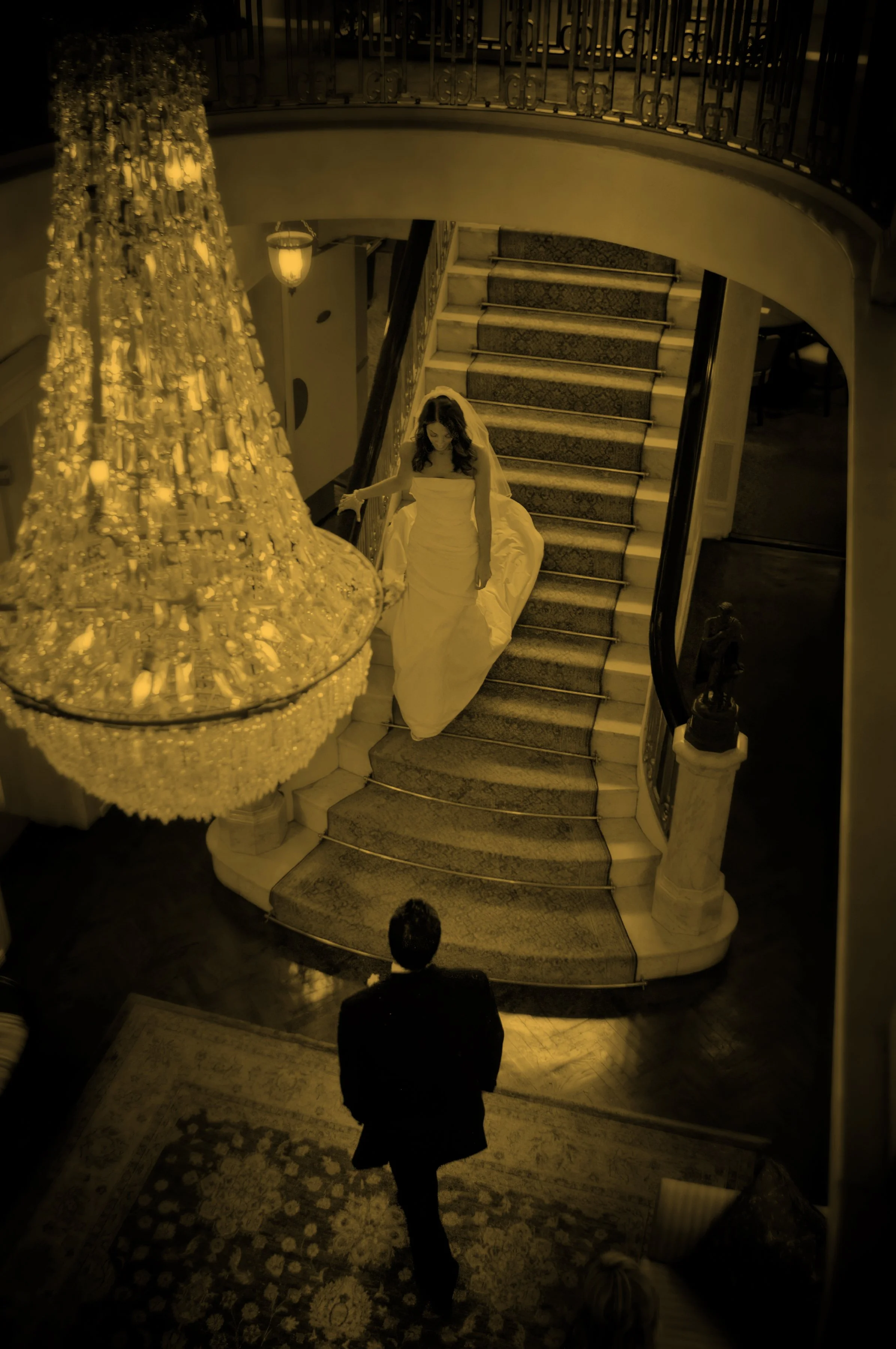 Bride descends the grand foyer staircase for her first look at Preakness Hills Country Club.