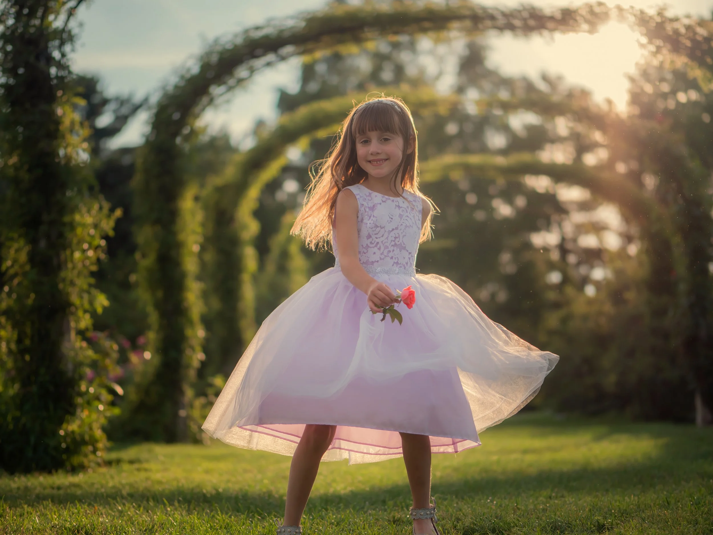 Jessica twirls through the rose garden, letting her imagination as a fairy named Rose take flight.