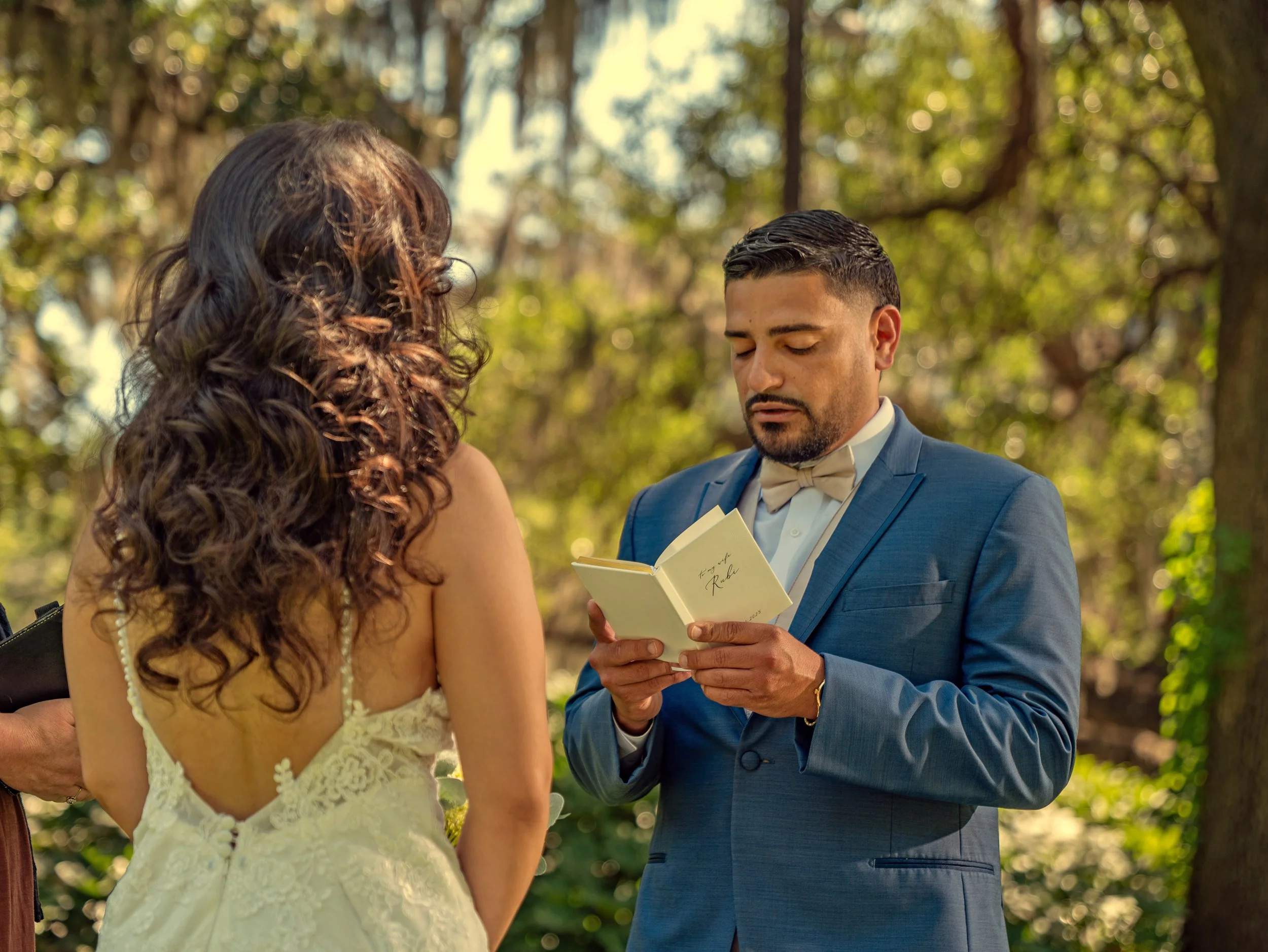 Groom reads his wedding vows during an intimate ceremony in Forsyth Park, Savannah.