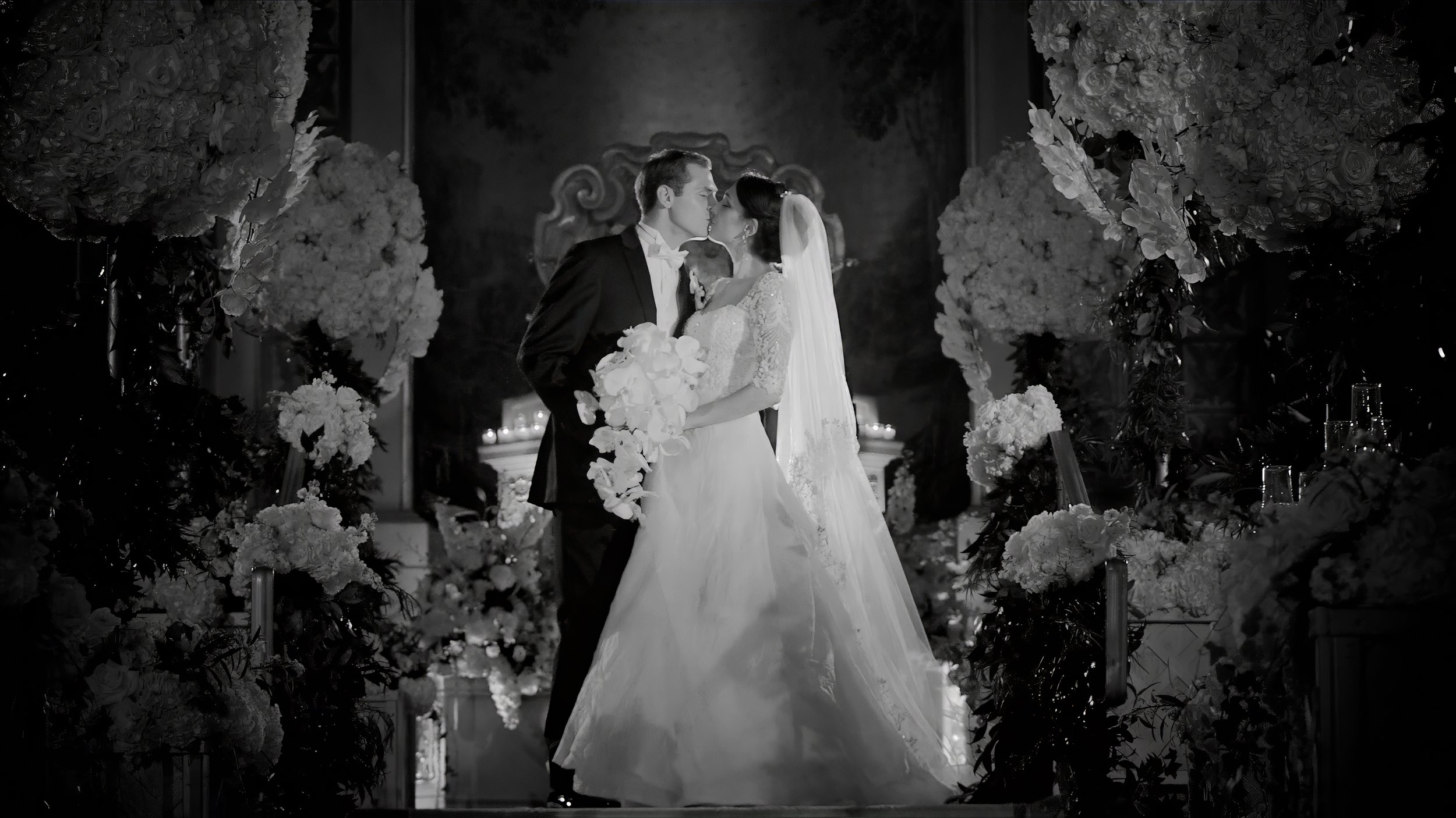 Romantic fine art portrait of a bride and groom kissing in the terrace room of the Plaza Hotel NYC, crafted by Maring.