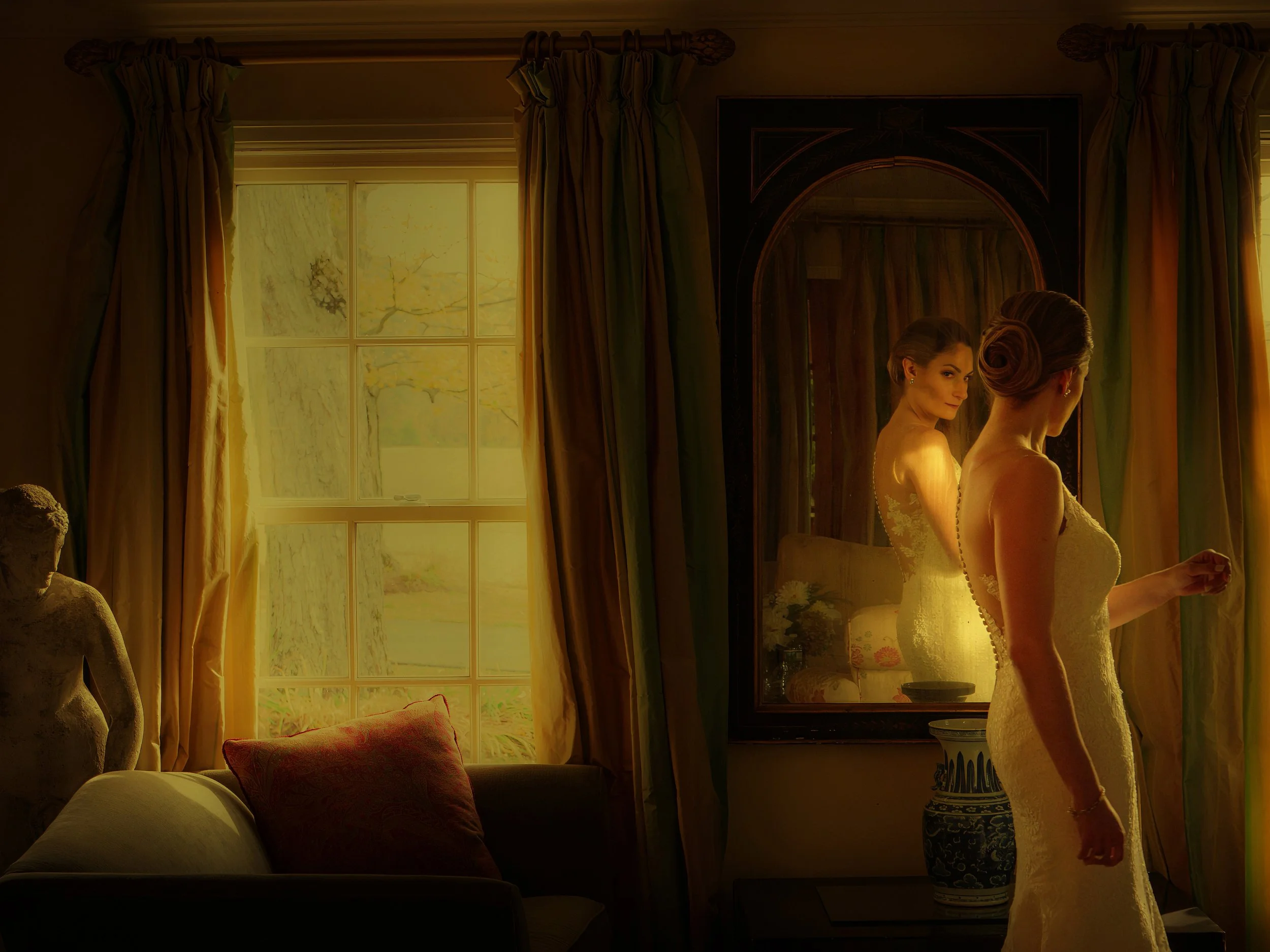 Bride taking a final look in the mirror before the ceremony inside the main house at Lion Rock Farm.