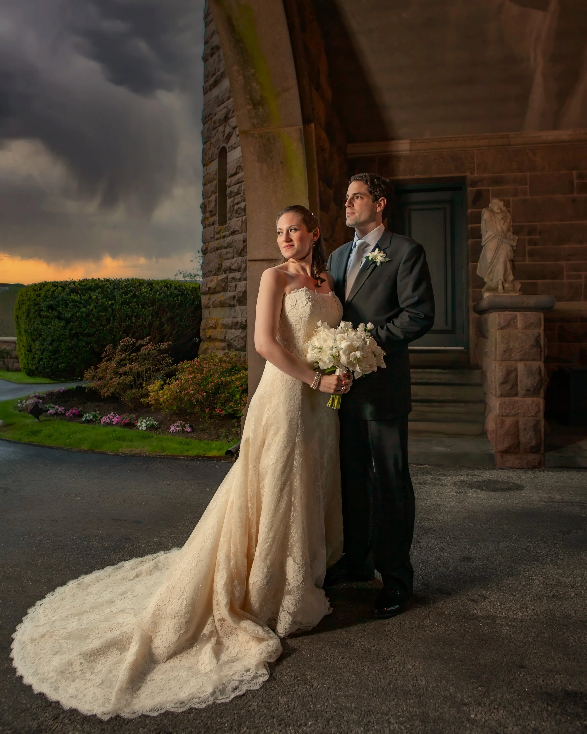 Bride and groom portrait under the archways at Ocean Cliff.