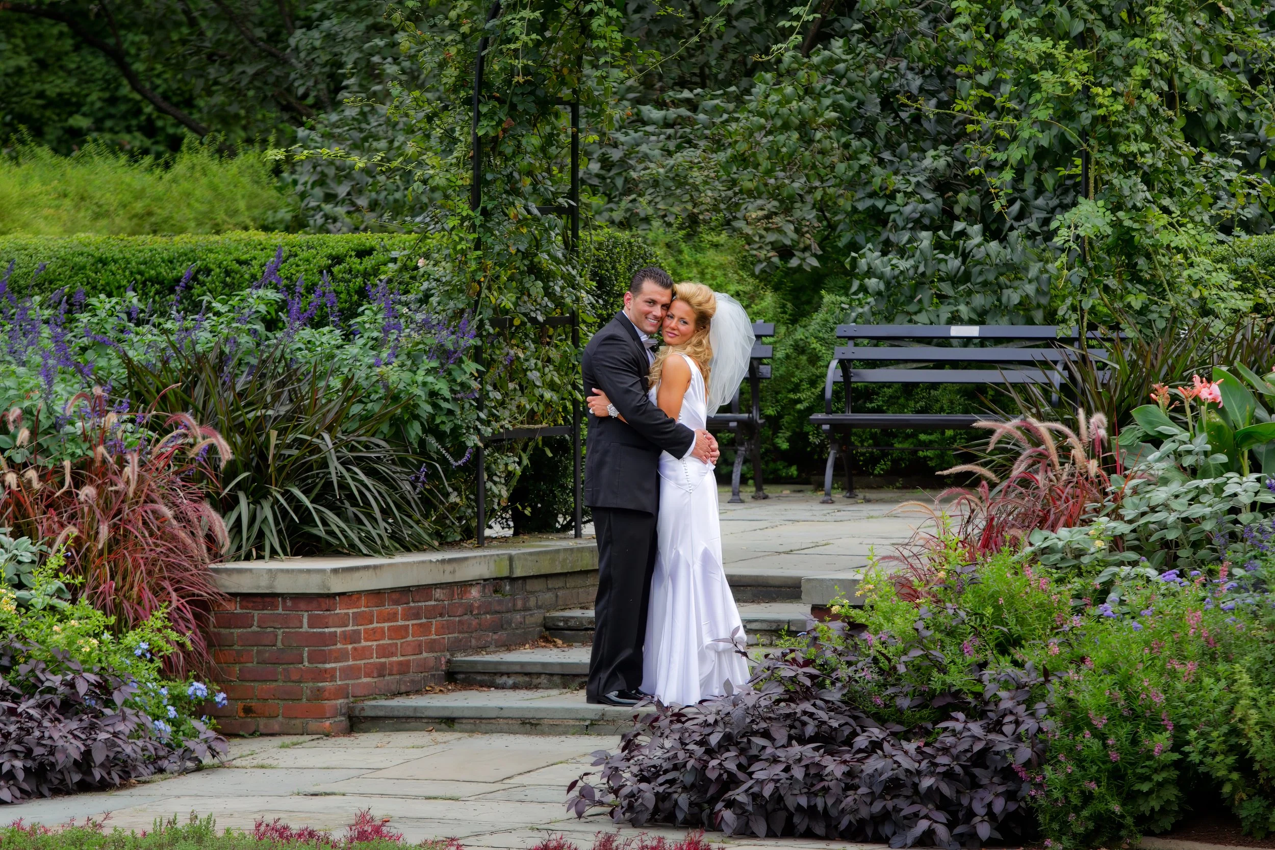 Bride and groom pose for a classic portrait in Central Park near The Pierre Hotel NYC