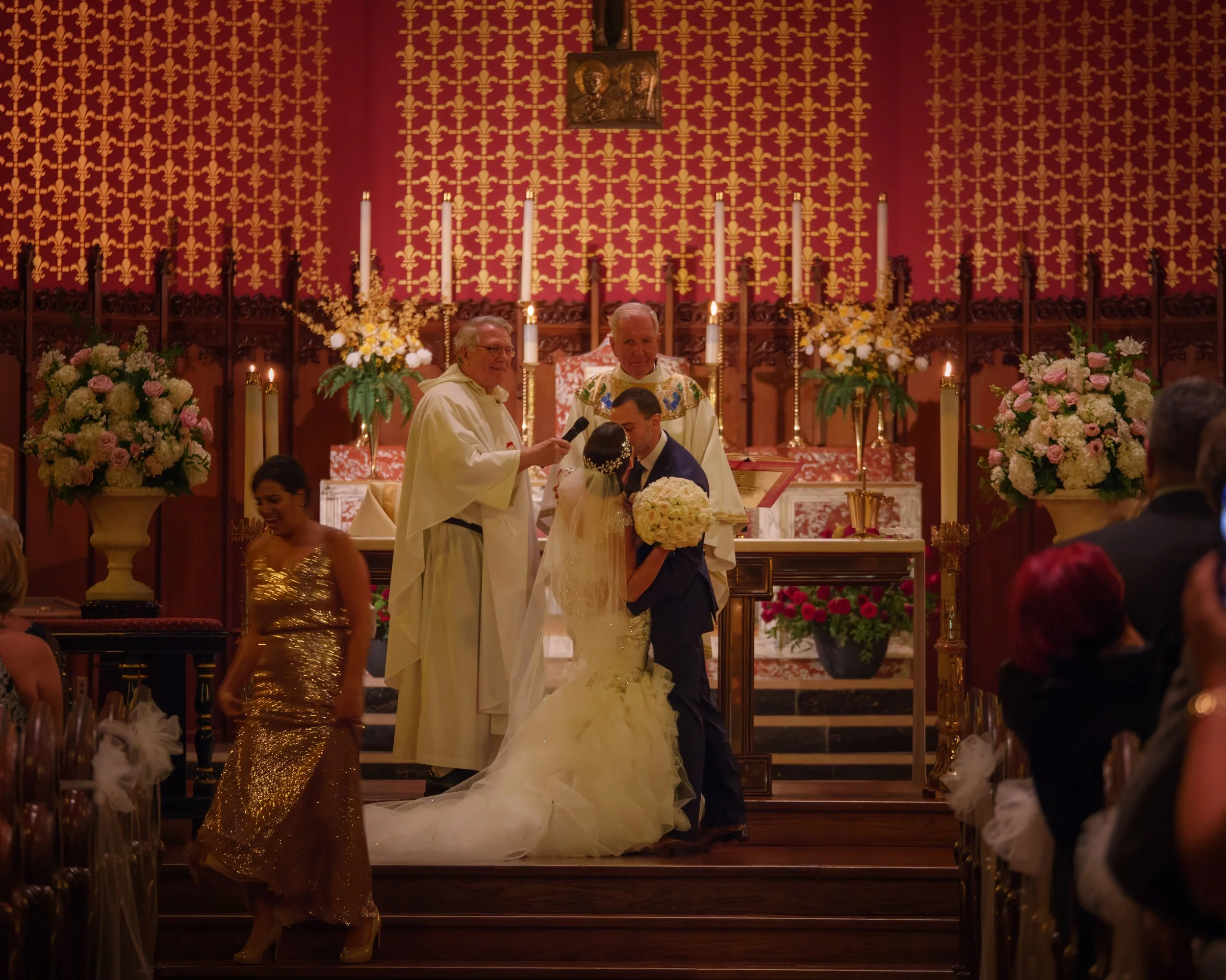 First kiss as husband and wife during a wedding ceremony at Saint Mary Church on Hillhouse Avenue in New Haven Connecticut