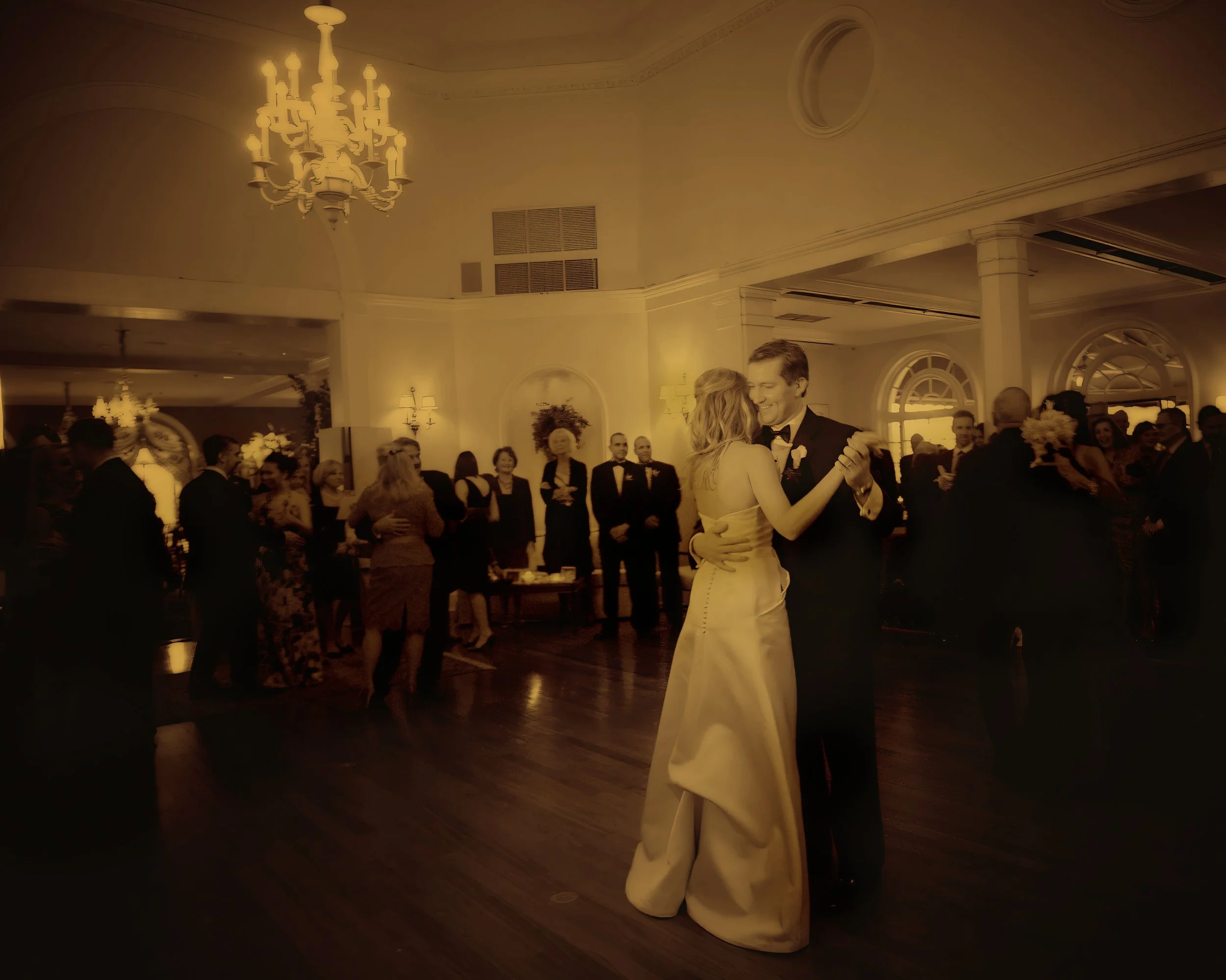 Bride and groom share their first dance at Siwanoy Country Club captured in a fine art wedding photograph.