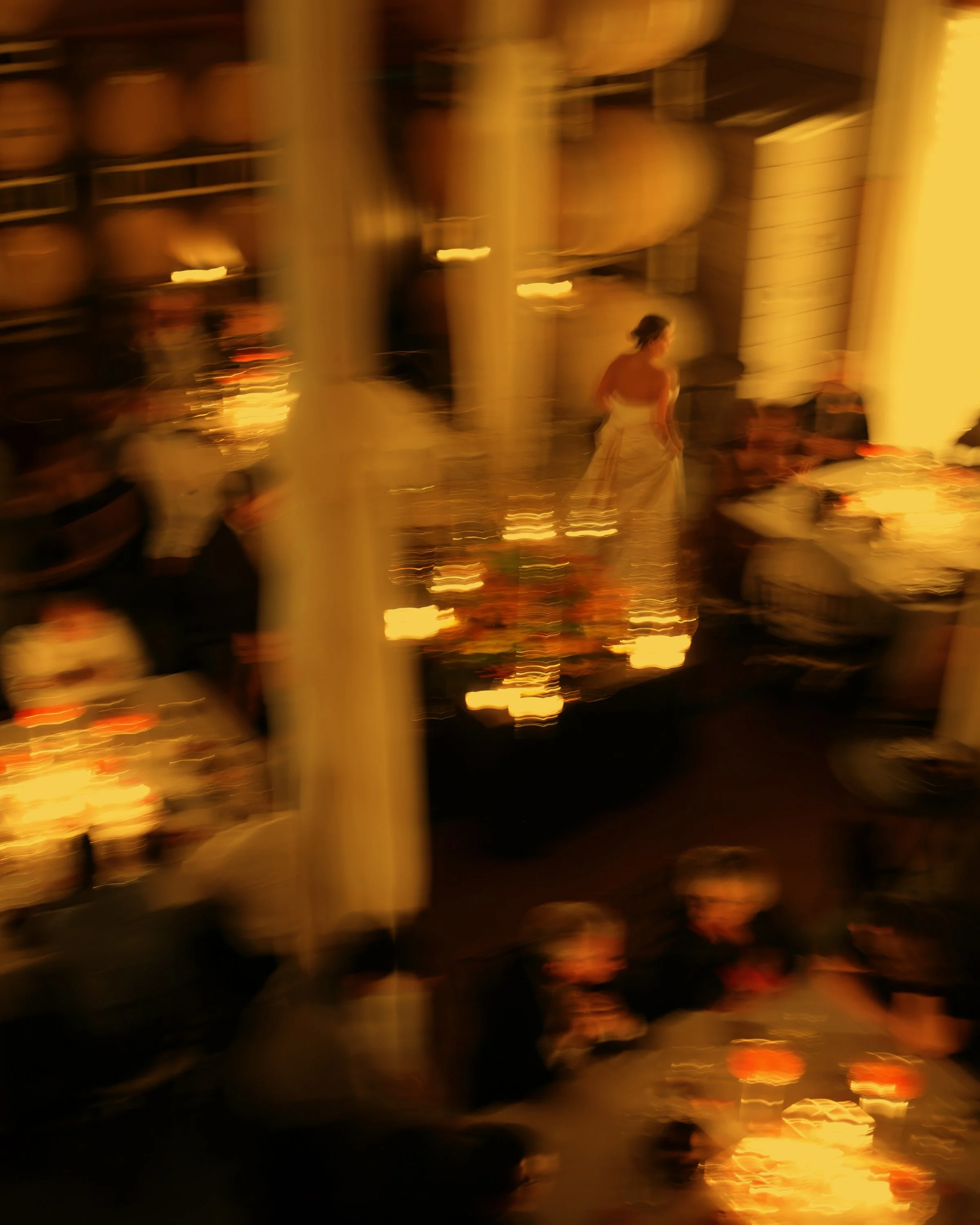 Bride moving gracefully through her wedding reception at Jonathan Edwards Winery in Stonington Connecticut.