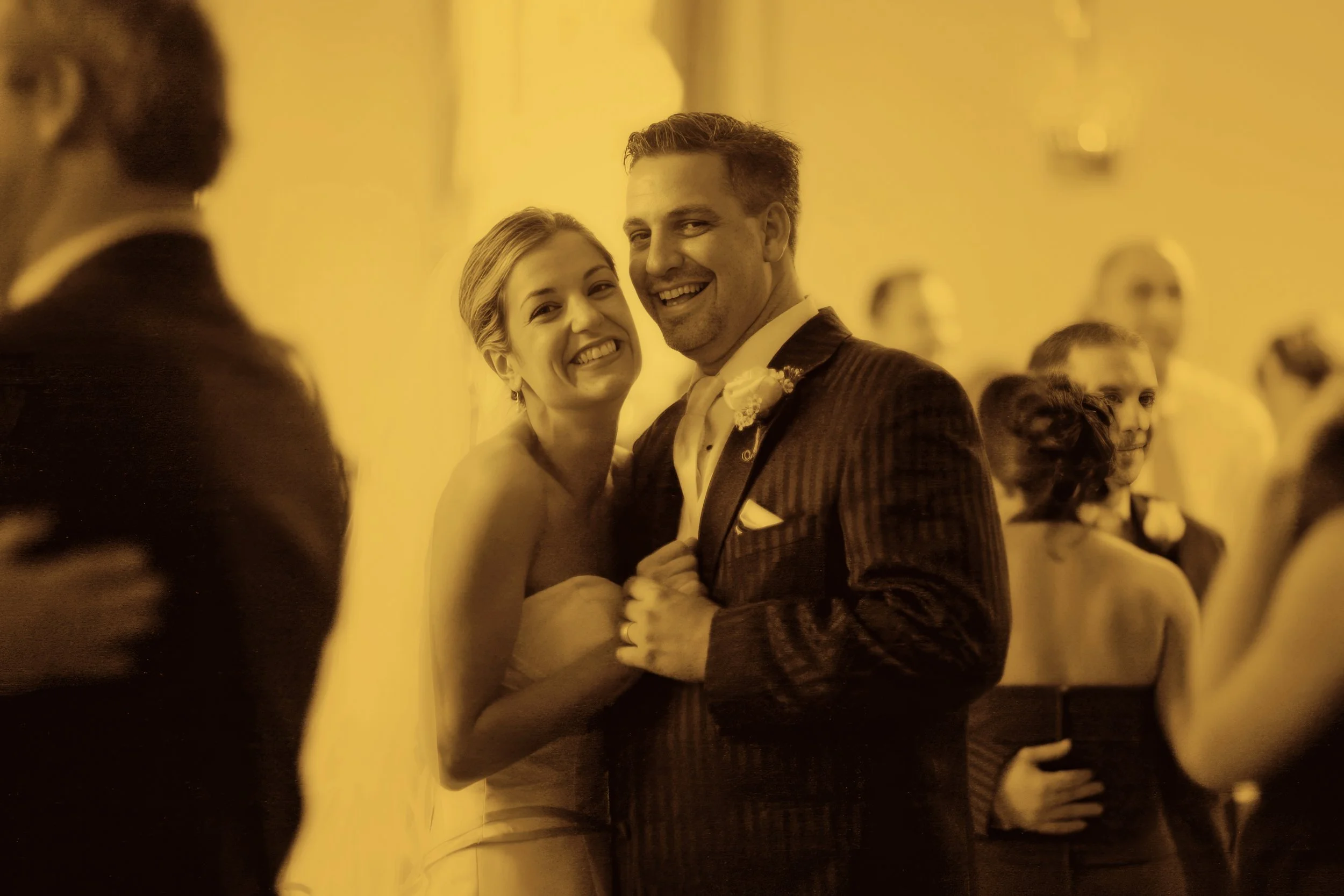 Joyful first dance on the ballroom dance floor at the New Haven Lawn Club wedding reception.