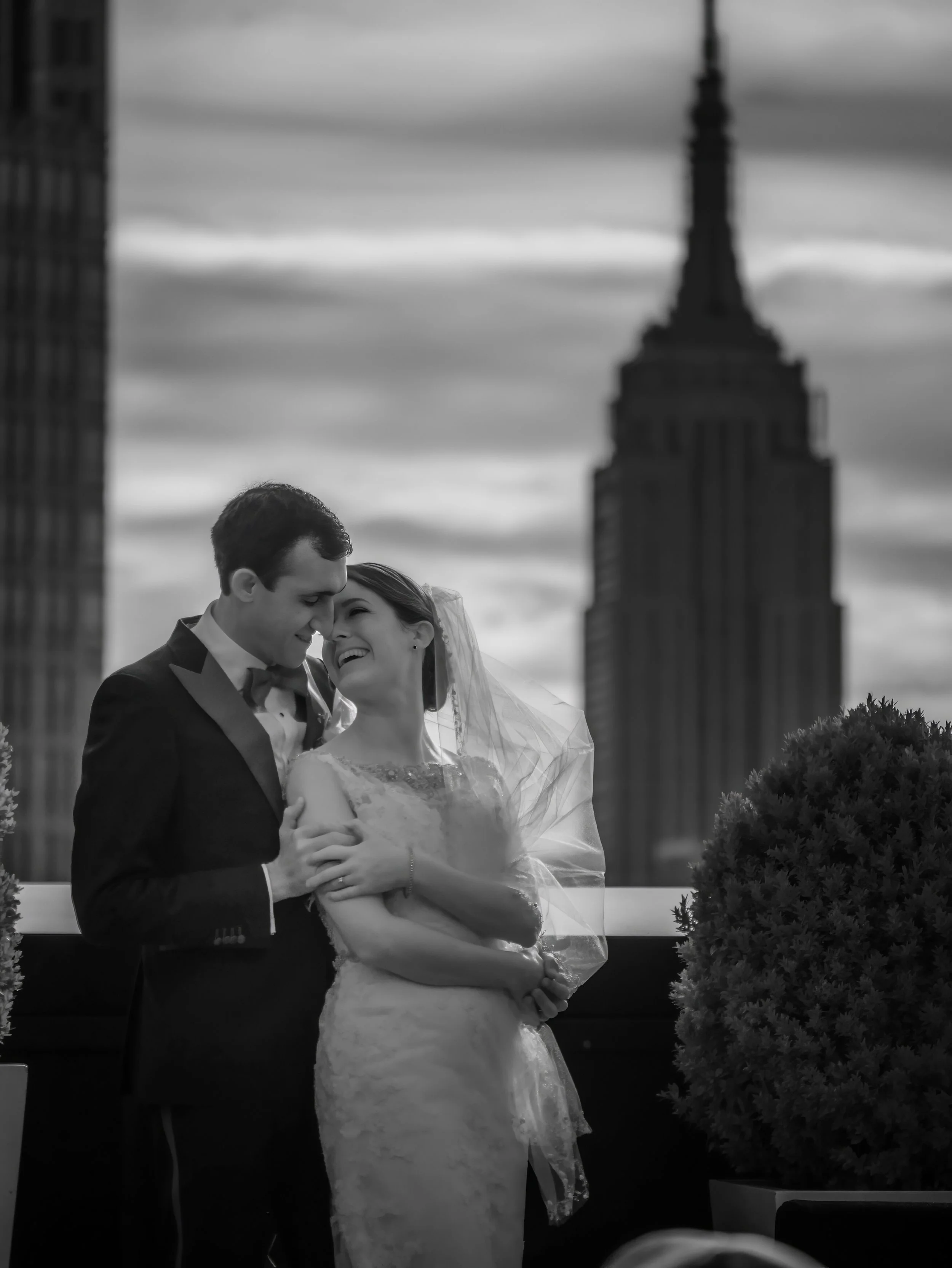 Bride and groom on the rooftop of the Lotte New York Palace Midtown Manhattan wedding portrait