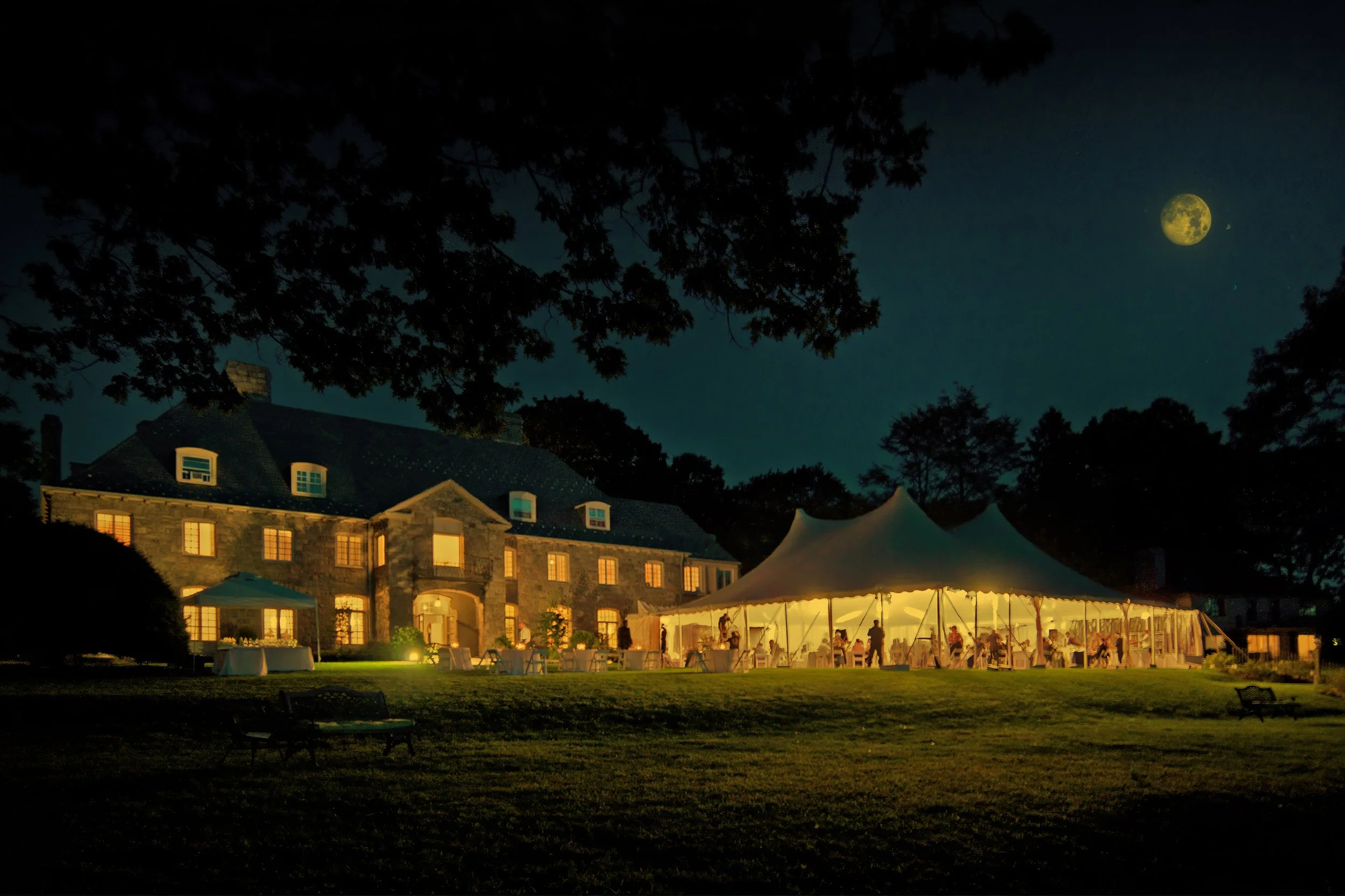 Wainwright House illuminated under the night sky.