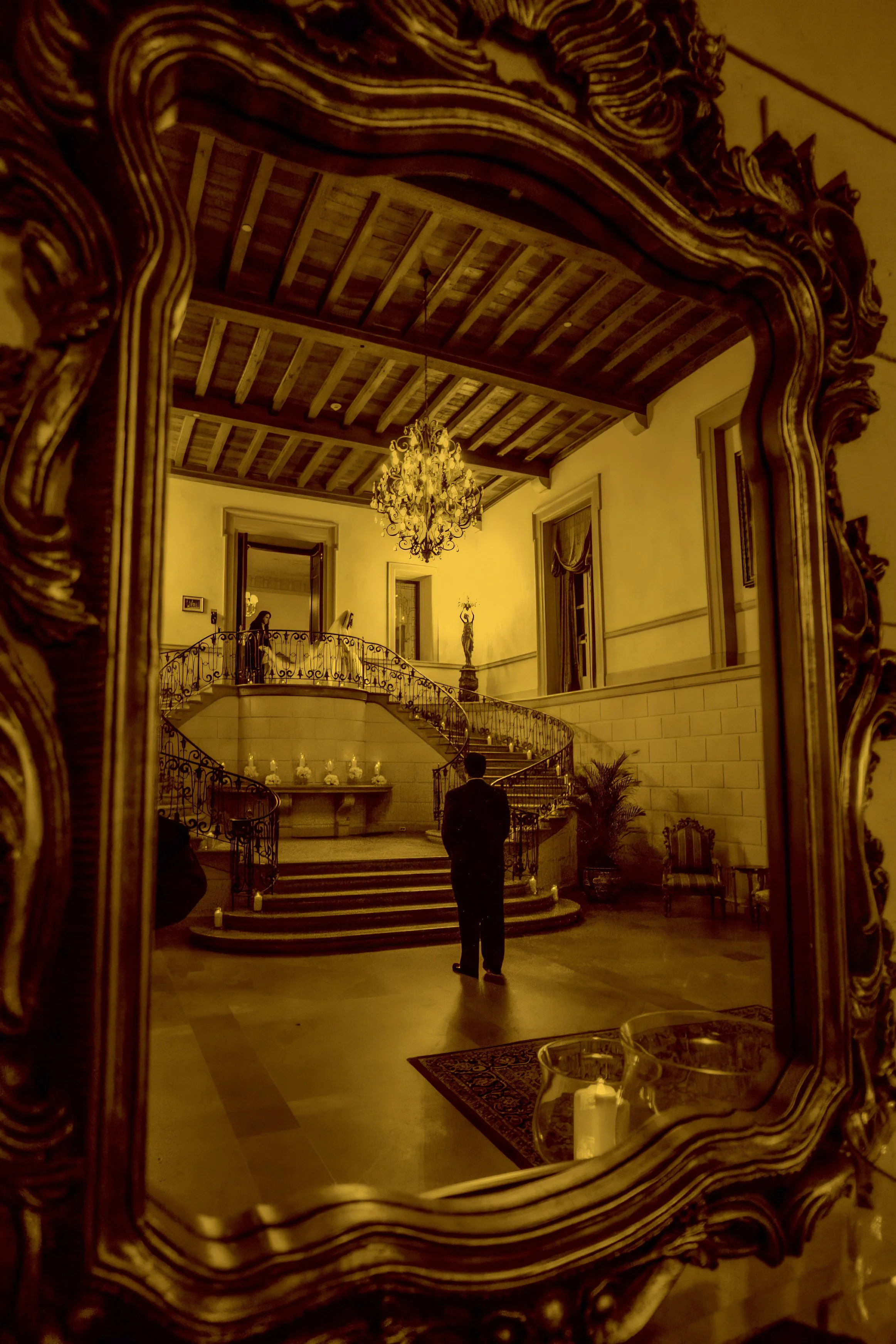 First look reflection in the mirror of the foyer at Oheka Castle
