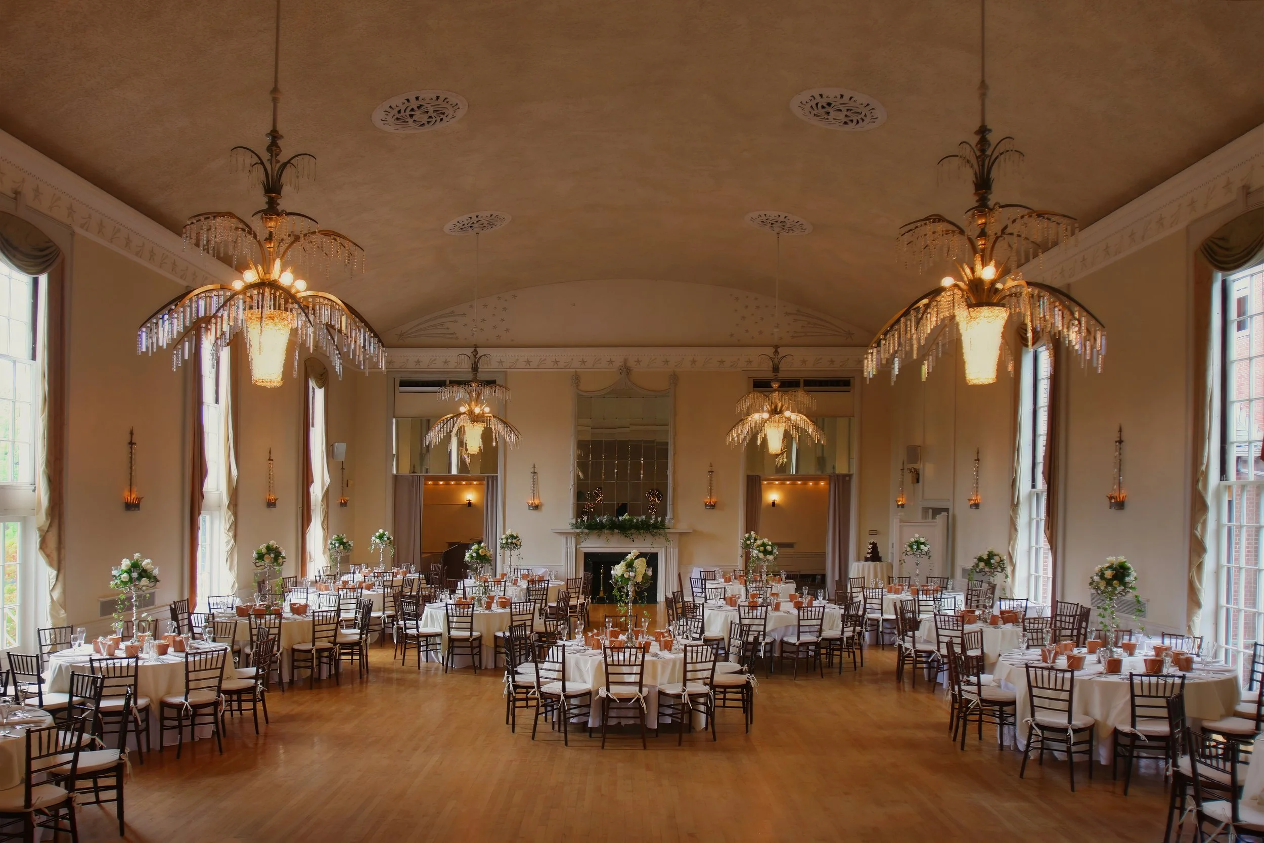 Sweeping view of the New Haven Lawn Club ballroom decorated for an elegant wedding reception.