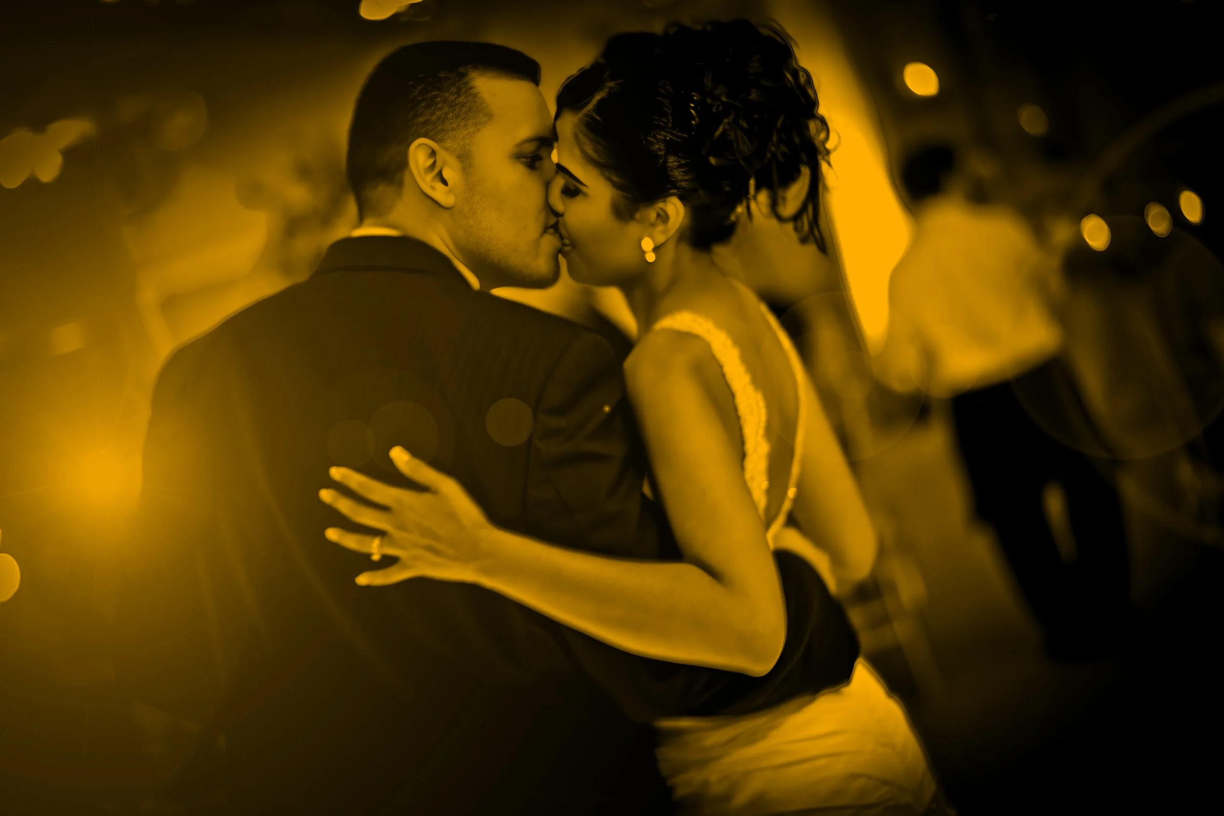 Fine art split toned portrait of bride and groom kissing on the dance floor at Delamar Greenwich Harbor wedding reception.