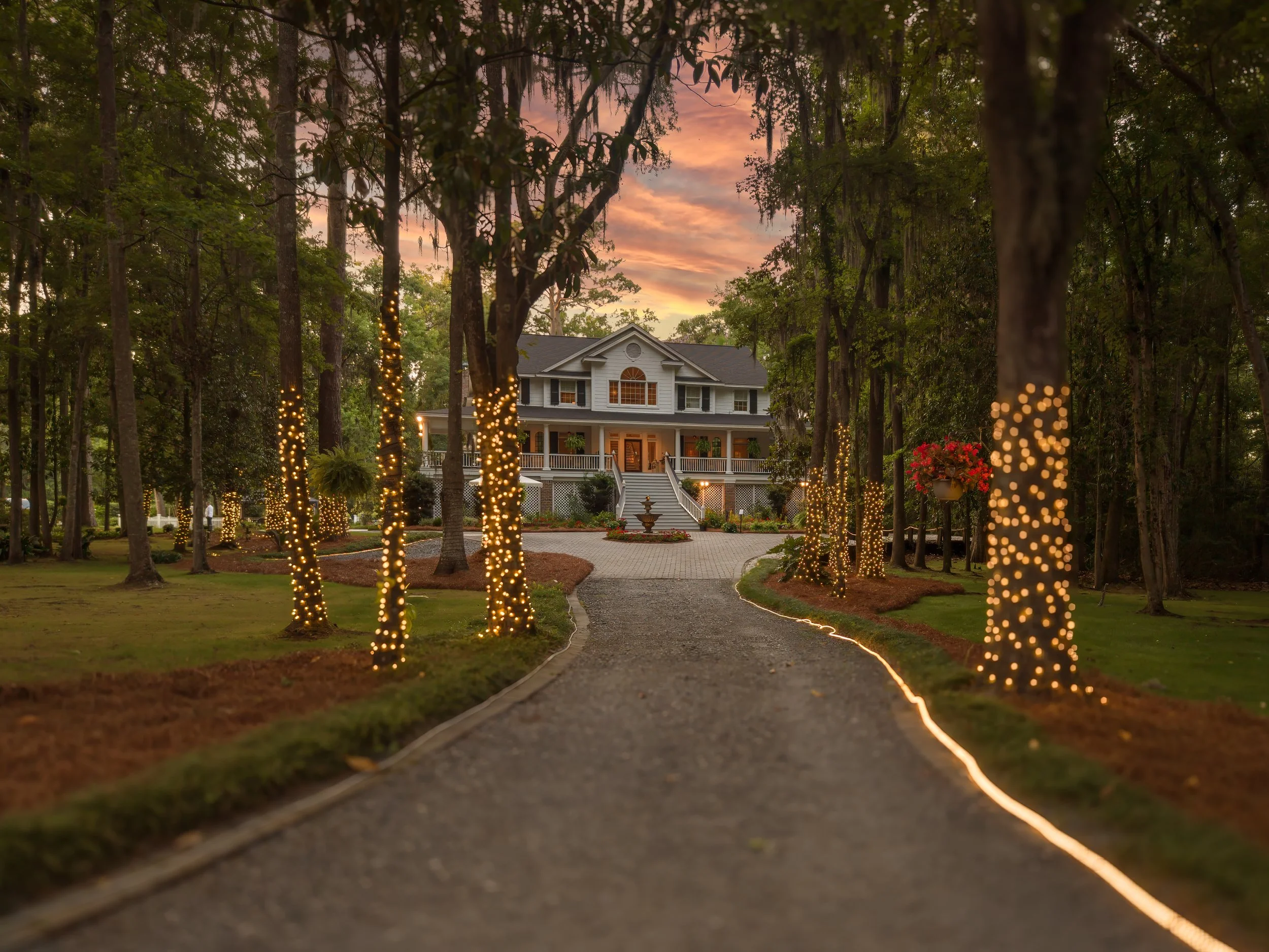 The front entrance to The Mackey House main house illuminated in evening light in Savannah, Georgia.