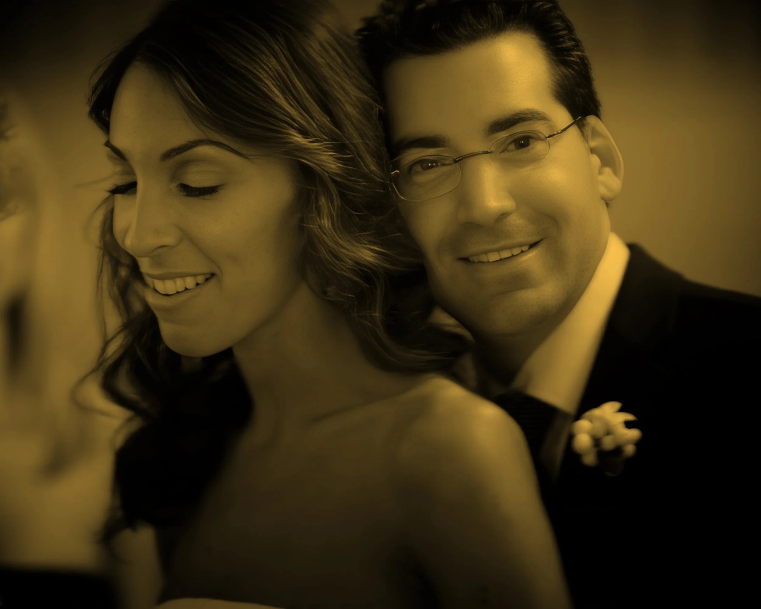 Intimate candid of the bride and groom sharing a romantic moment.