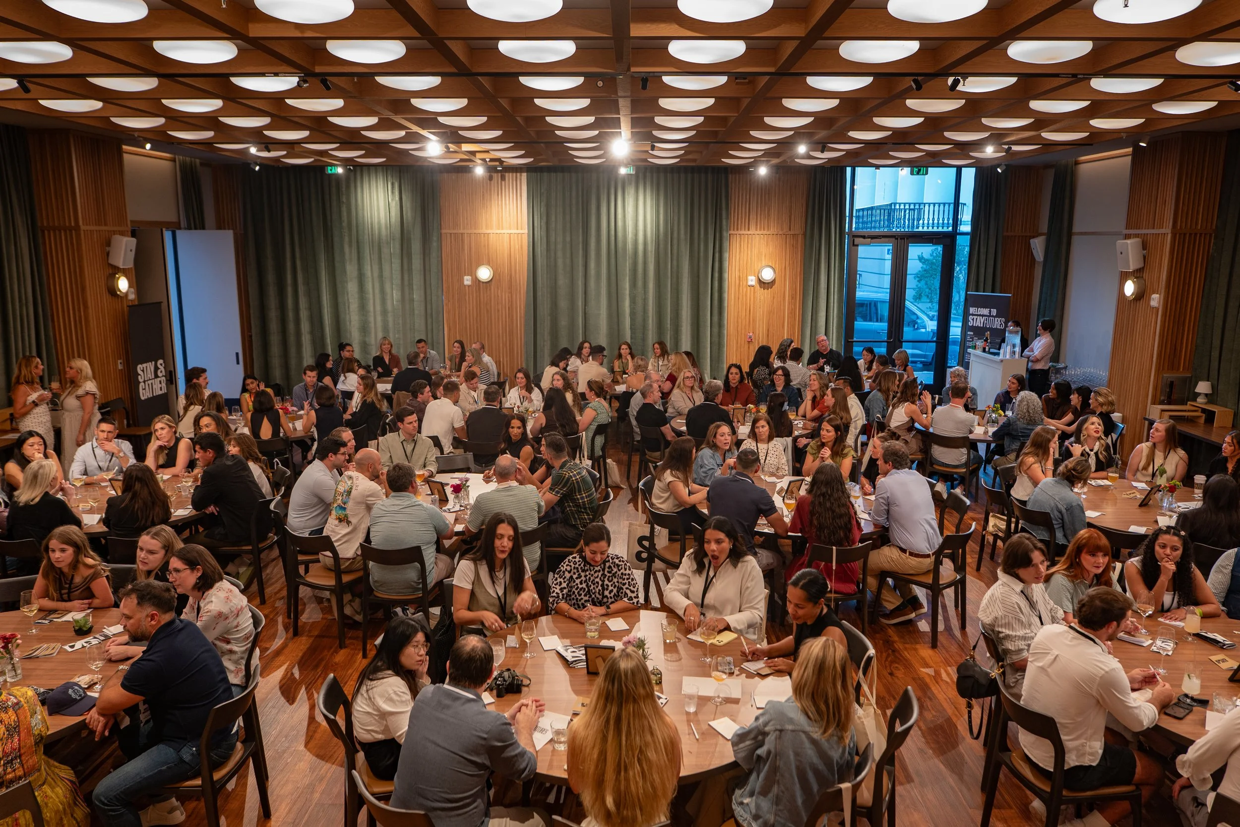 Hospitality professionals and creative leaders engaged in roundtable discussions during the Stay and Gather corporate conference at Recess Hotel & Club in Savannah, Georgia.