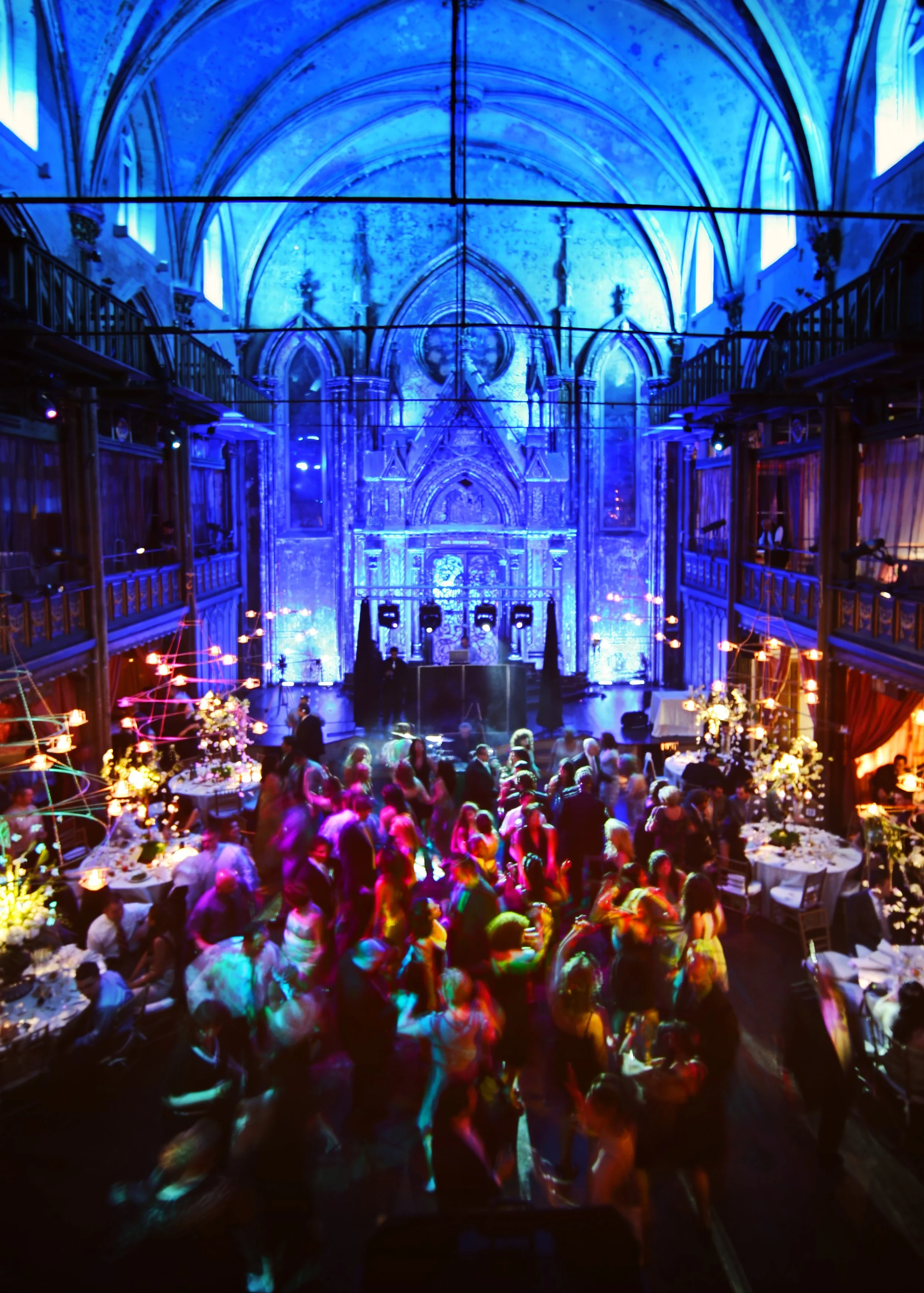 Wedding guests dancing during a colorful, club-like reception atmosphere at Angel Orensanz in New York City.