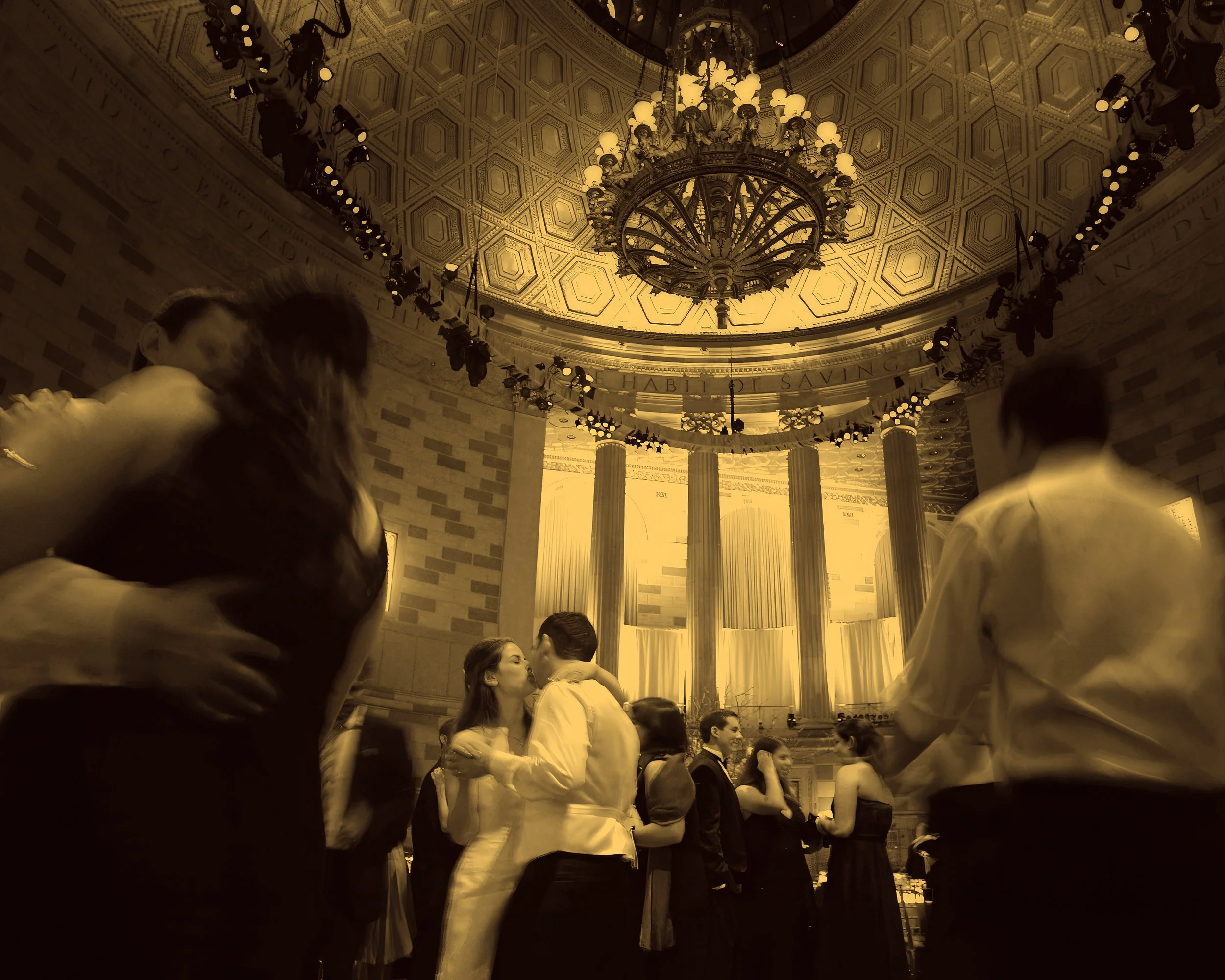 Bride and groom share an intimate moment on the dance floor as guests celebrate during their Gotham Hall wedding reception.
