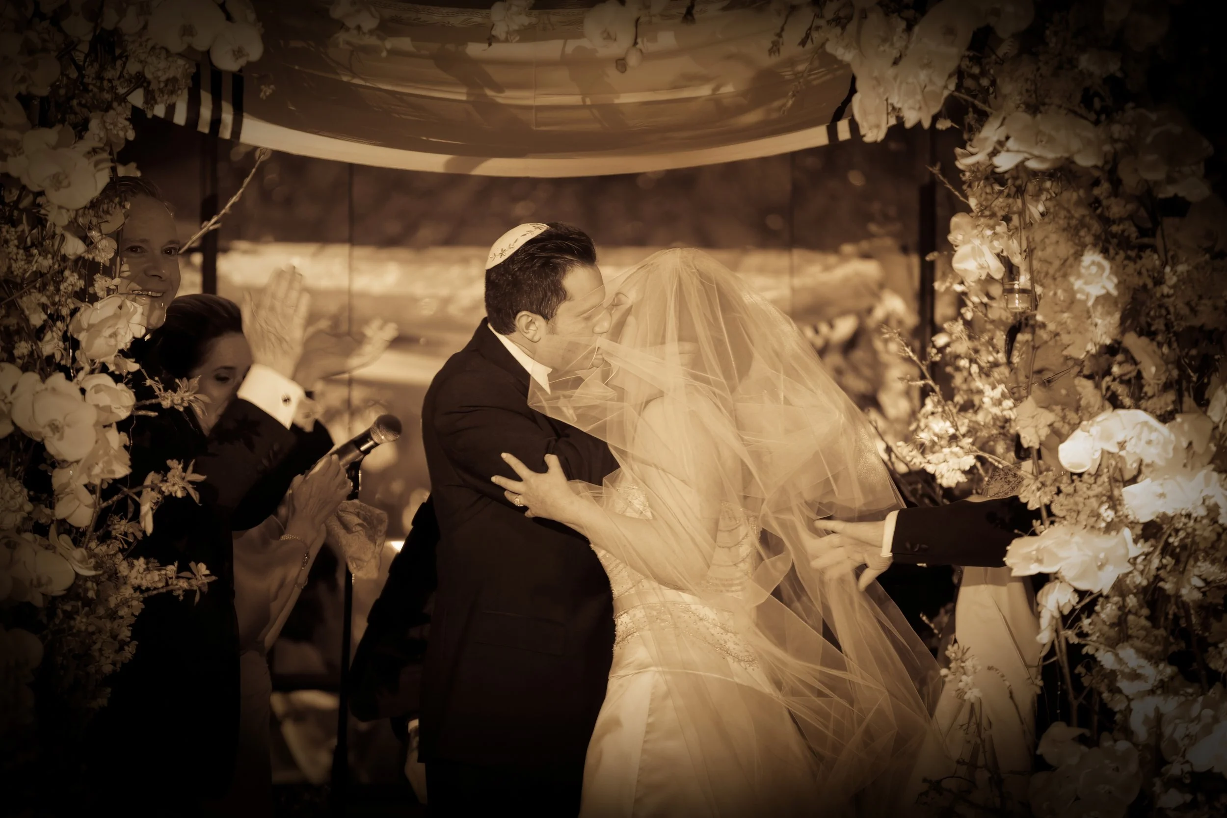 Bride and groom share their first kiss as husband and wife during a ceremony at The Pierre Hotel NYC