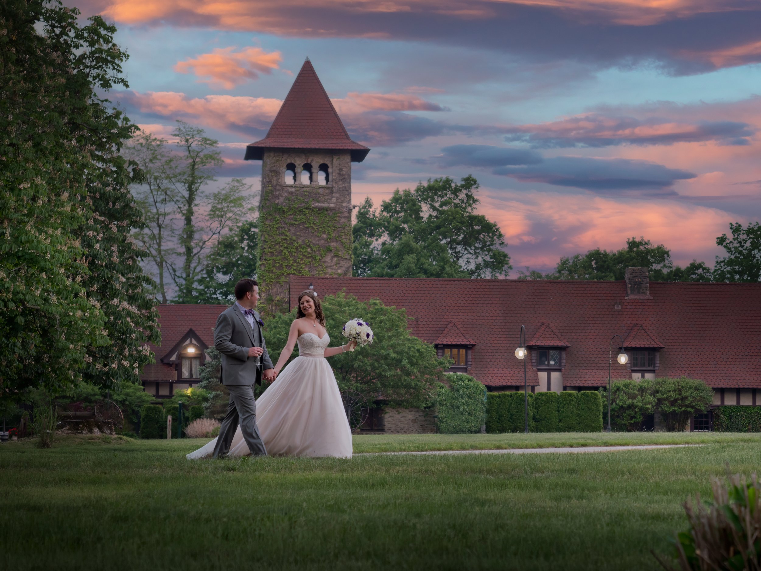 Bride and groom walking through Saint Clements Castle grounds during Connecticut wedding