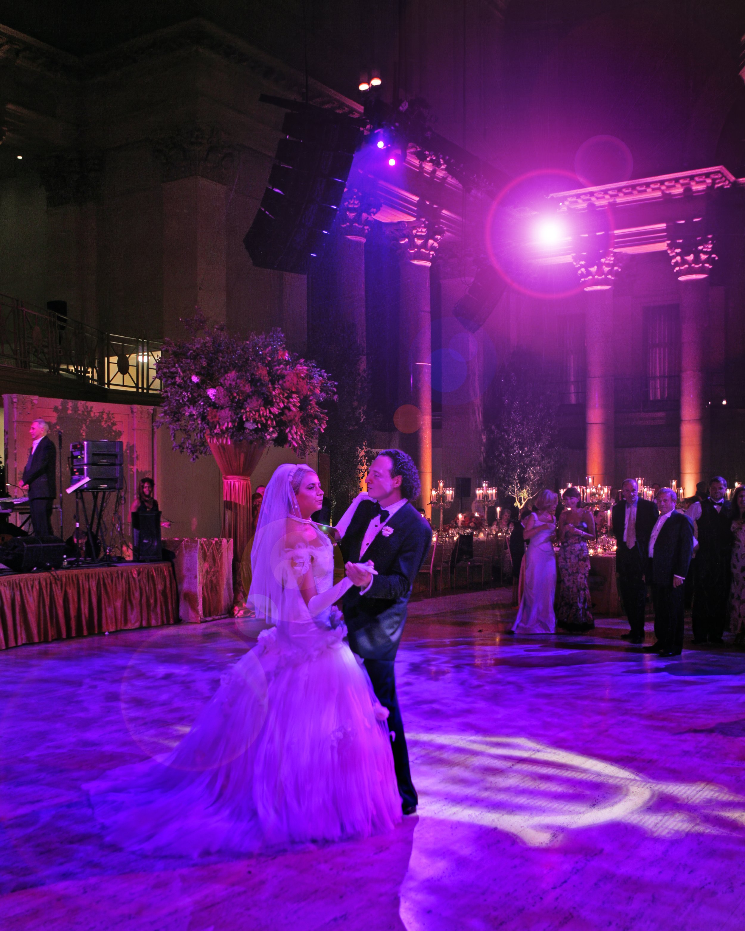 Bride dancing with her father under warm ambient light during a wedding reception at Cipriani Wall Street.