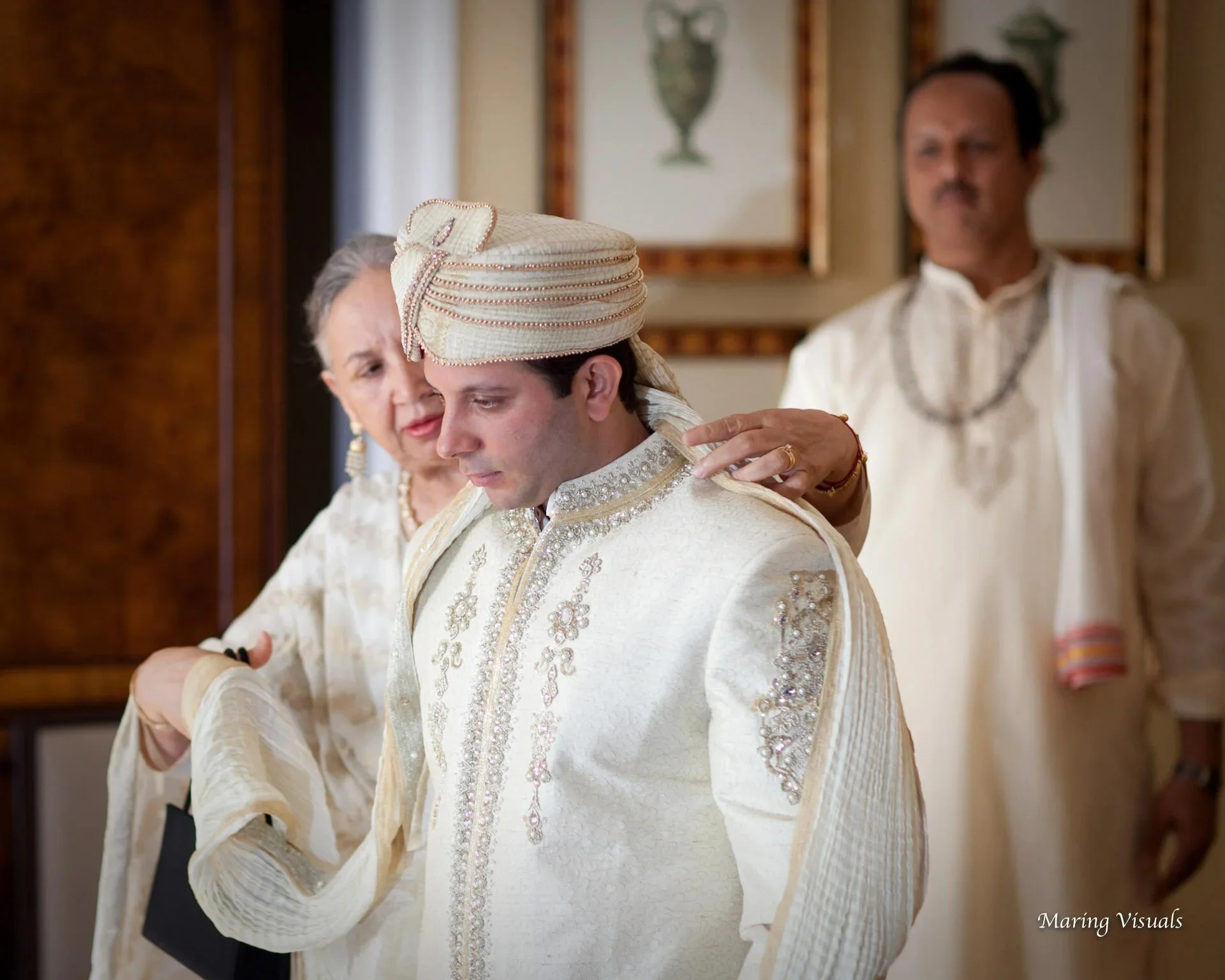 The groom being dressed in his hotel suite at the Mandarin Oriental NYC
