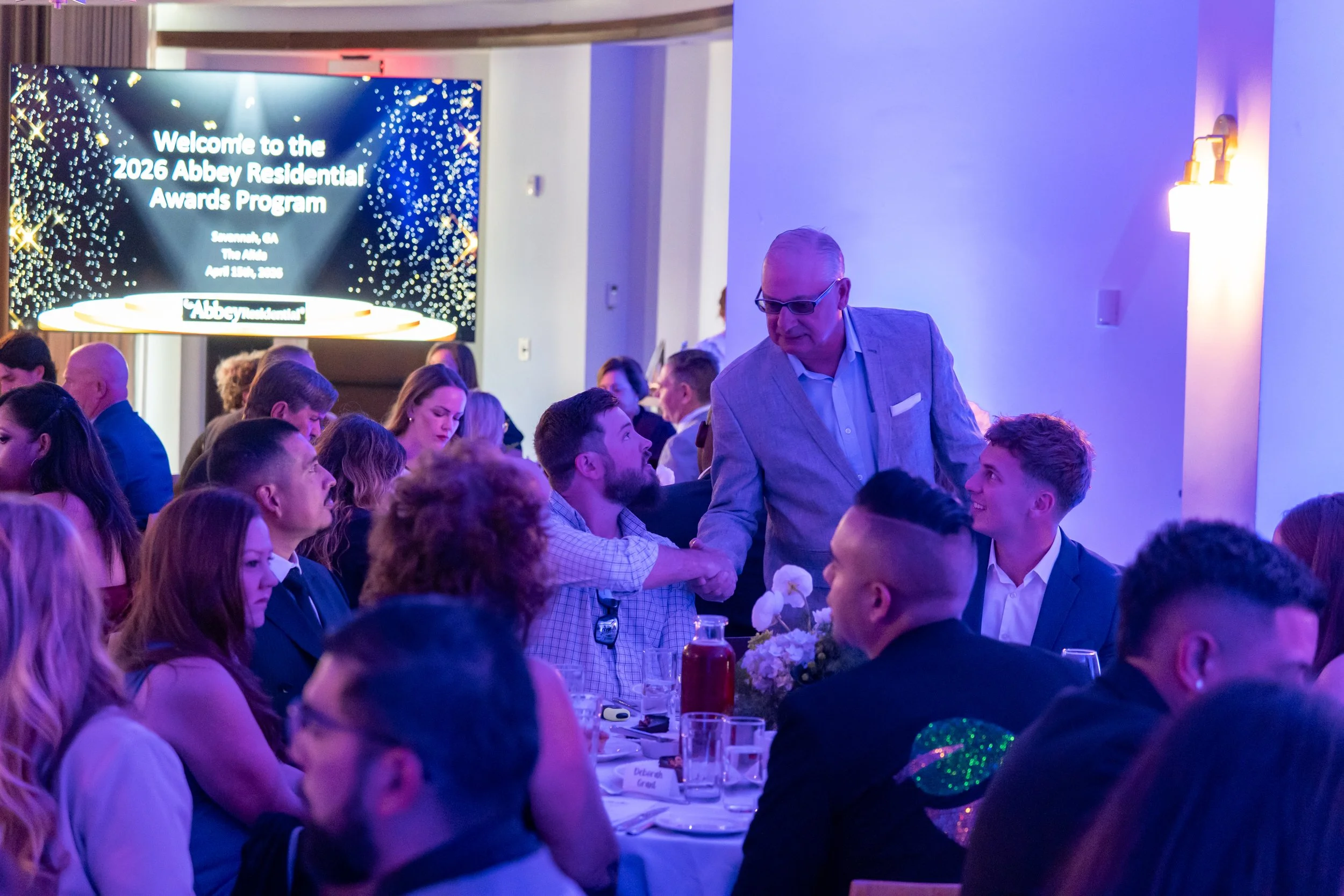 Guests mingling at corporate event photographed by Savannah corporate event photographer at The Alida Hotel