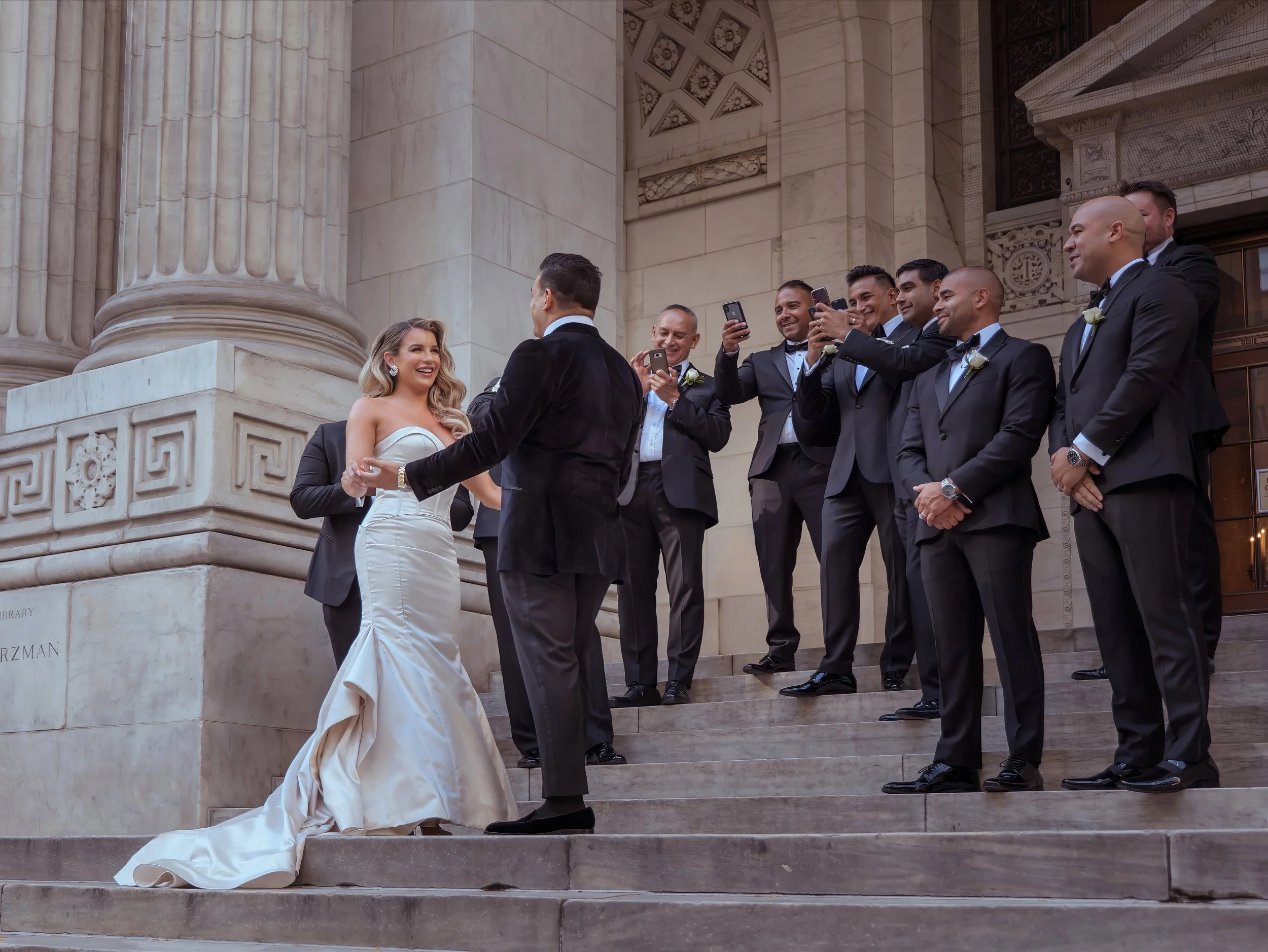 Bride and groom first look with wedding party at New York Public Library before Bryant Park Grill wedding