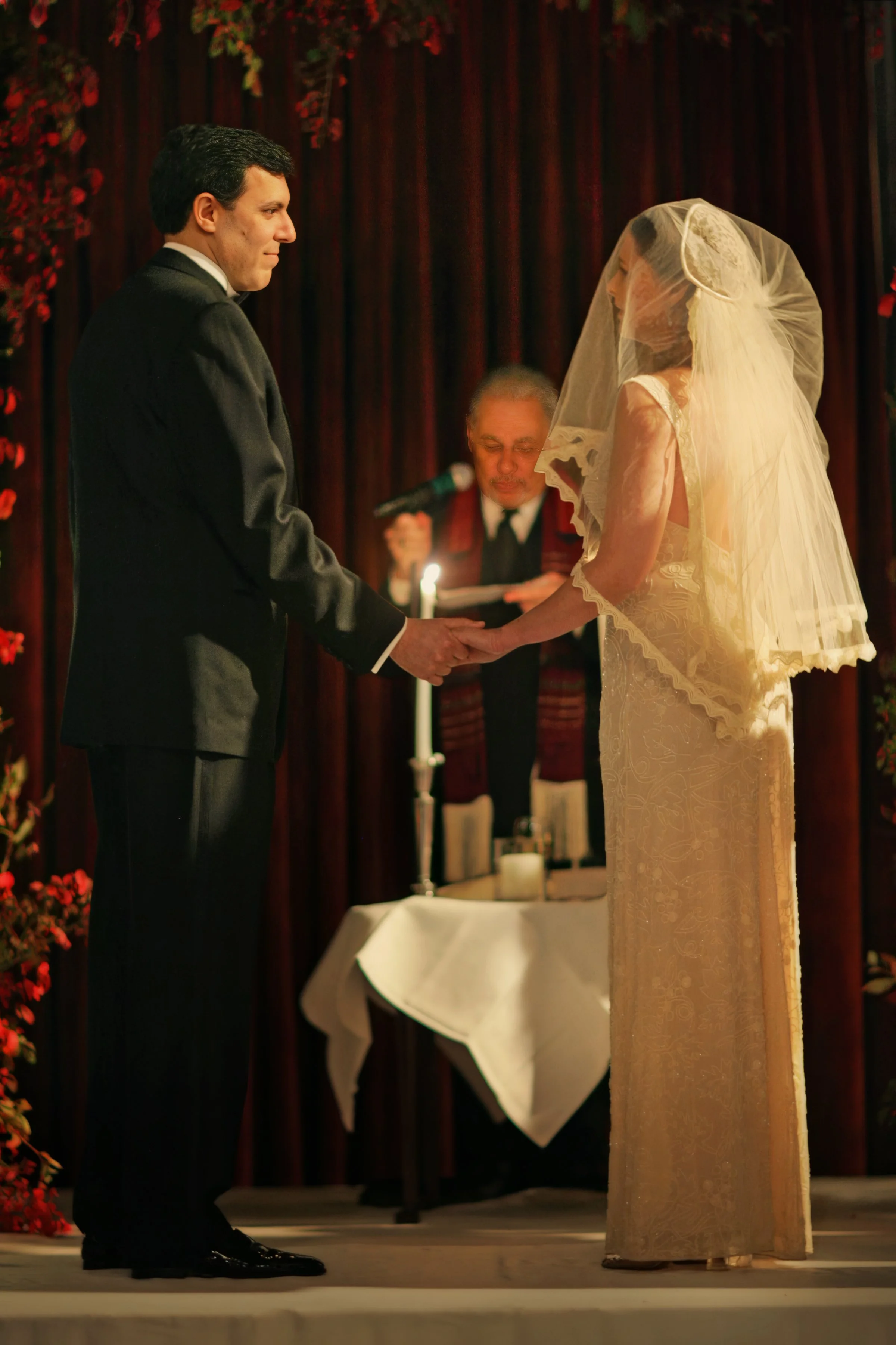 Bride and groom exchange vows during their wedding ceremony at The Harvard Club in New York City.