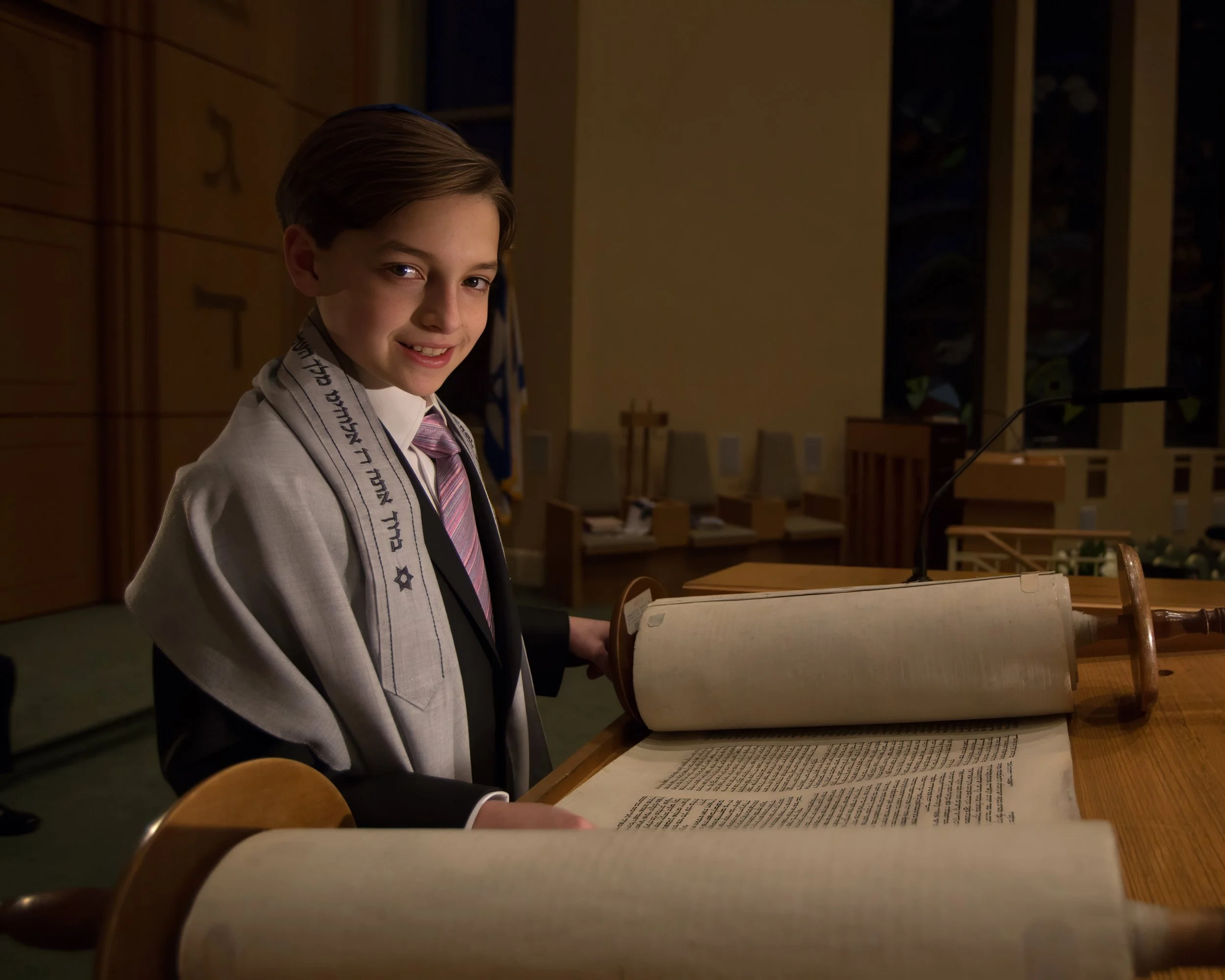 Young man reading the Torah during a Bar Mitzvah ceremony at a synagogue in Westchester New York