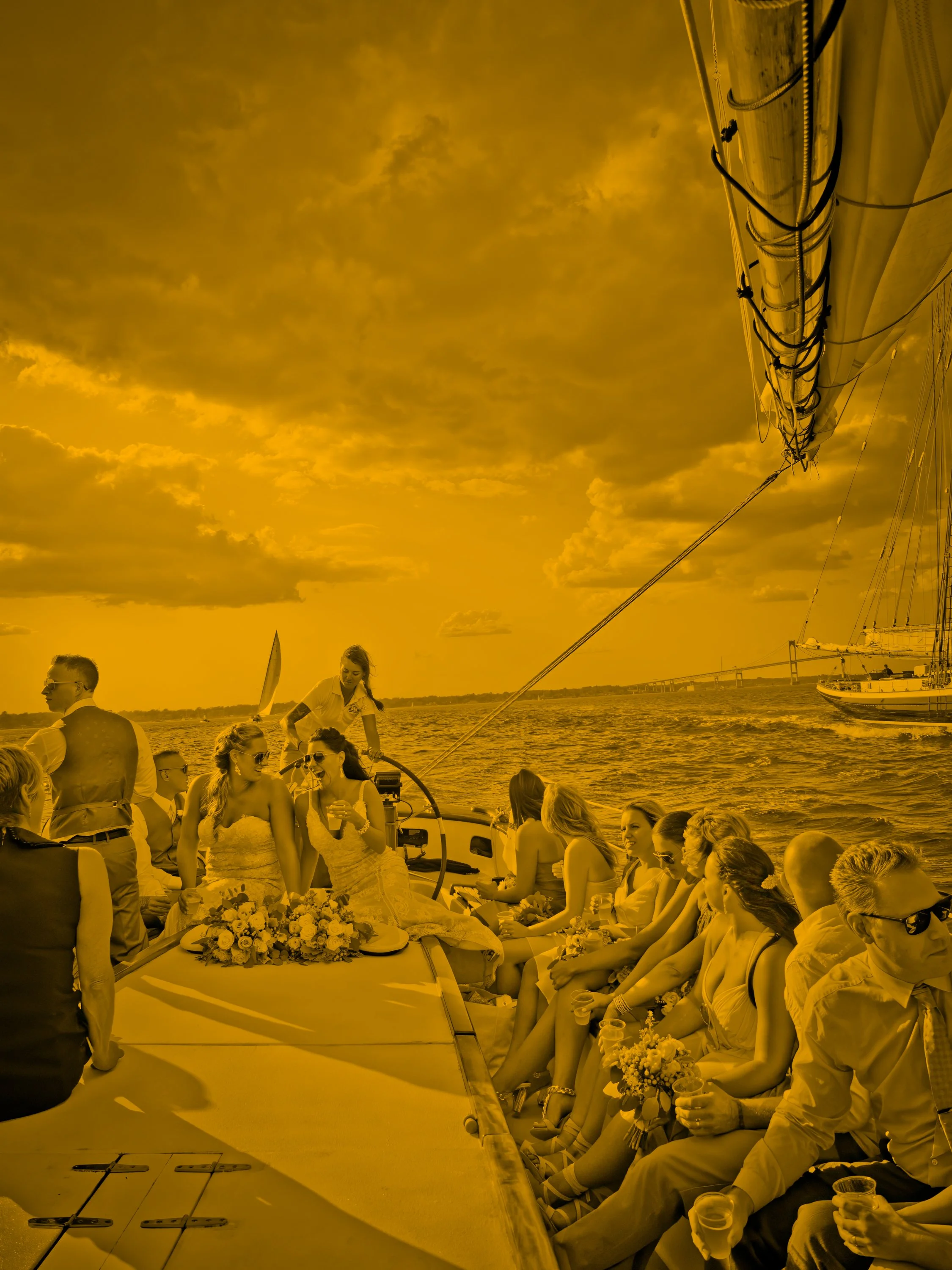 Bridal party sail on a schooner in Narragansett Bay after their ceremony at Newport Yachting Center.