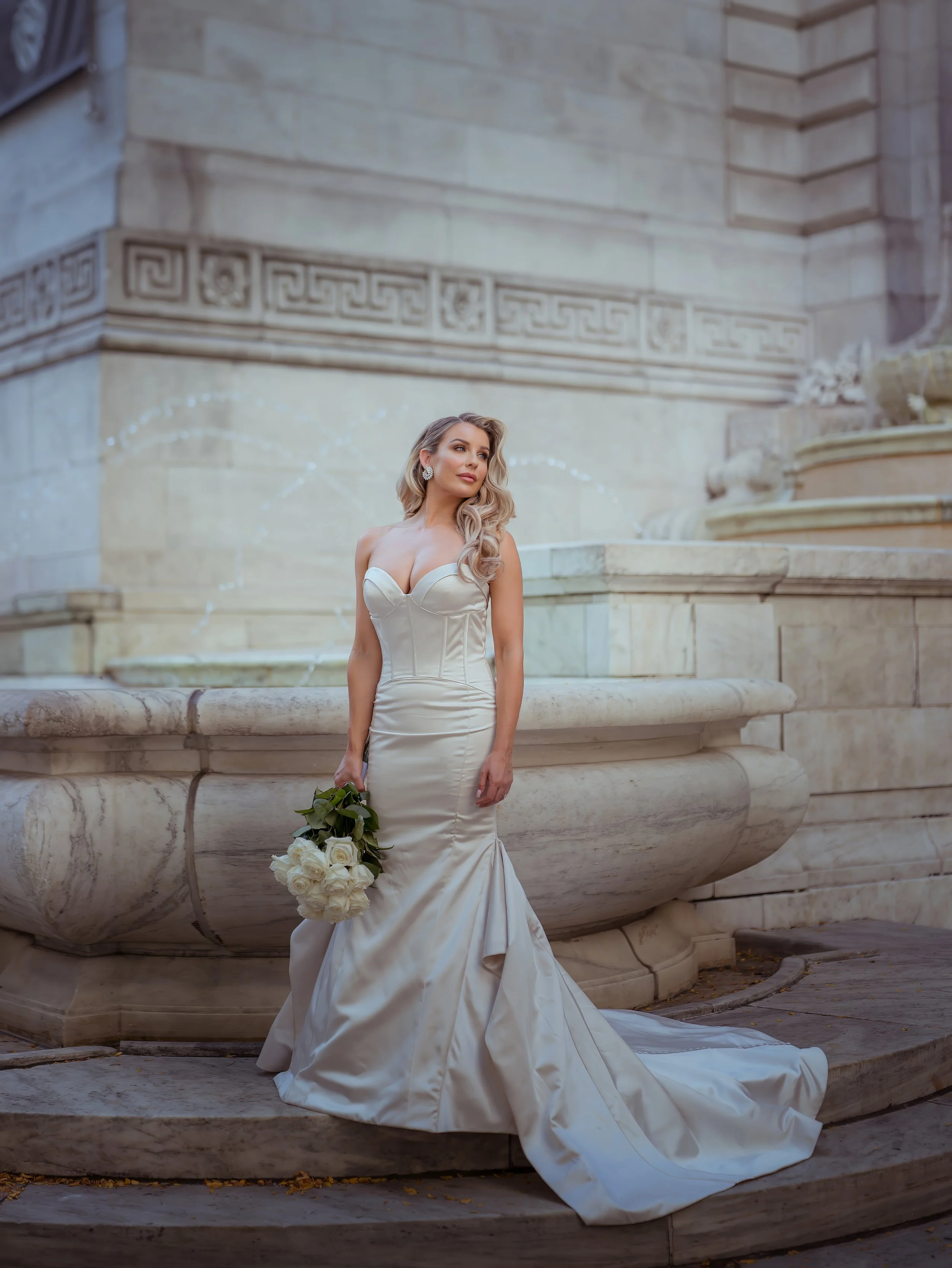 Elegant bridal portrait by the fountain at the New York Public Library wedding in Midtown Manhattan
