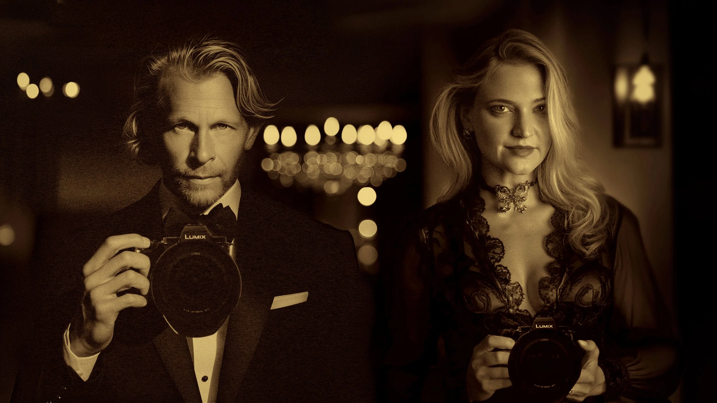 Charles and Jennifer Maring, award-winning luxury wedding and portrait photographers, posing together in a ballroom.