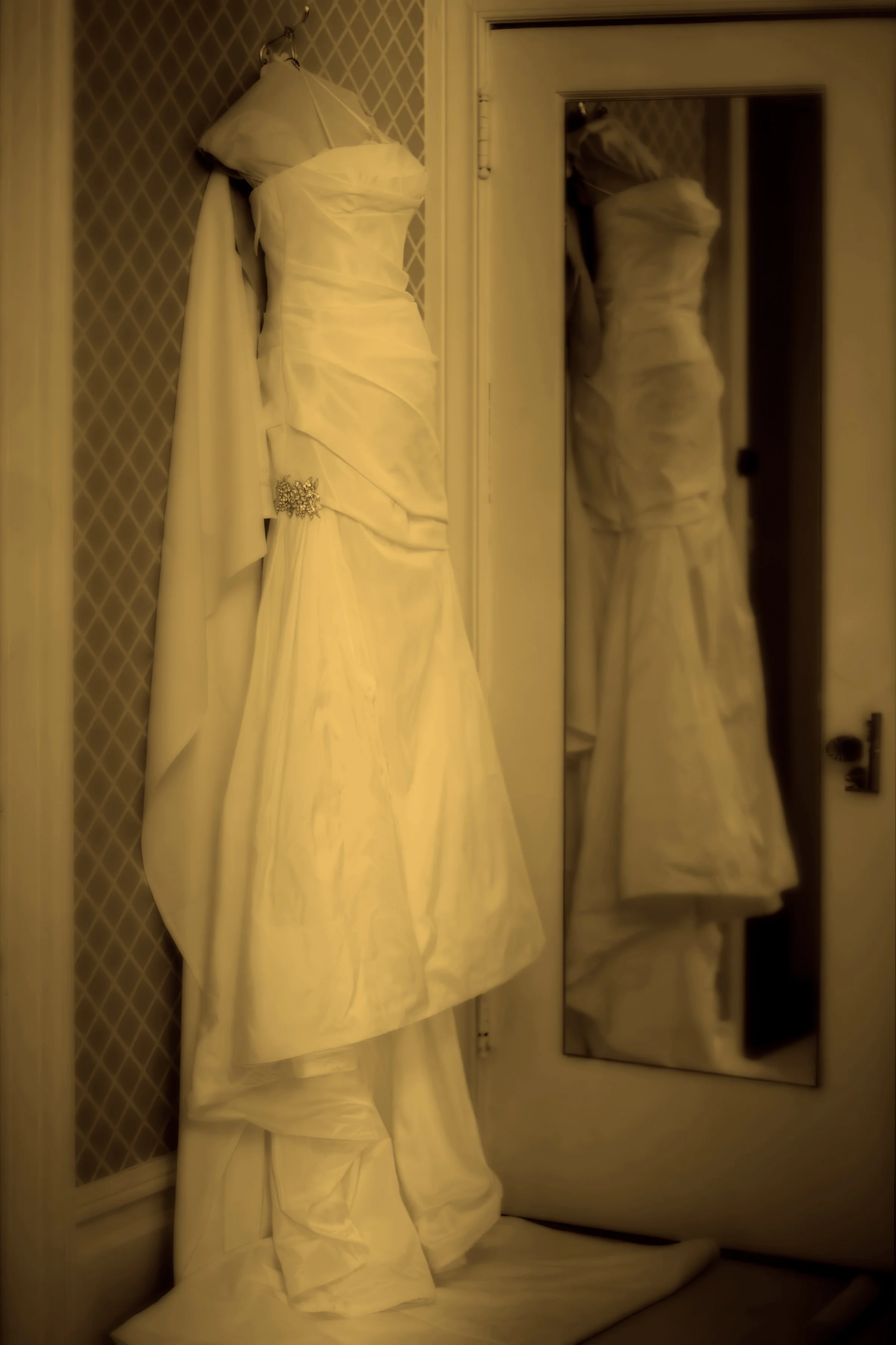 Wedding gown hanging gracefully in the upstairs bridal suite at Preakness Hills Country Club.