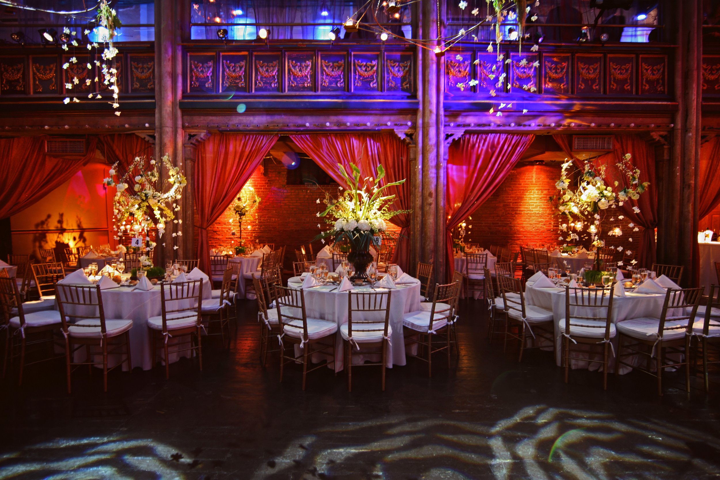 Elegant wedding decor displayed in the colorful ballroom at Angel Orensanz in Manhattan.