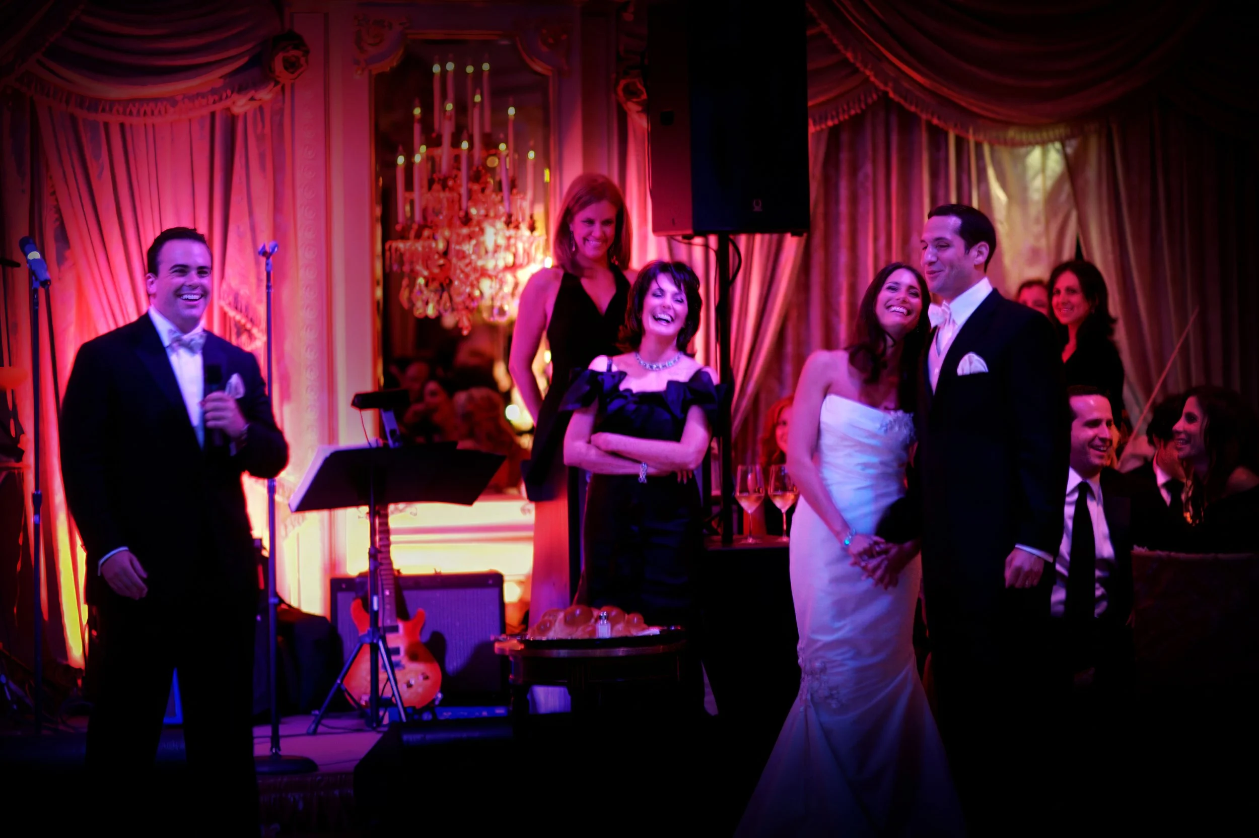 Playful wedding toast moment during a reception in the ballroom at St. Regis New York.