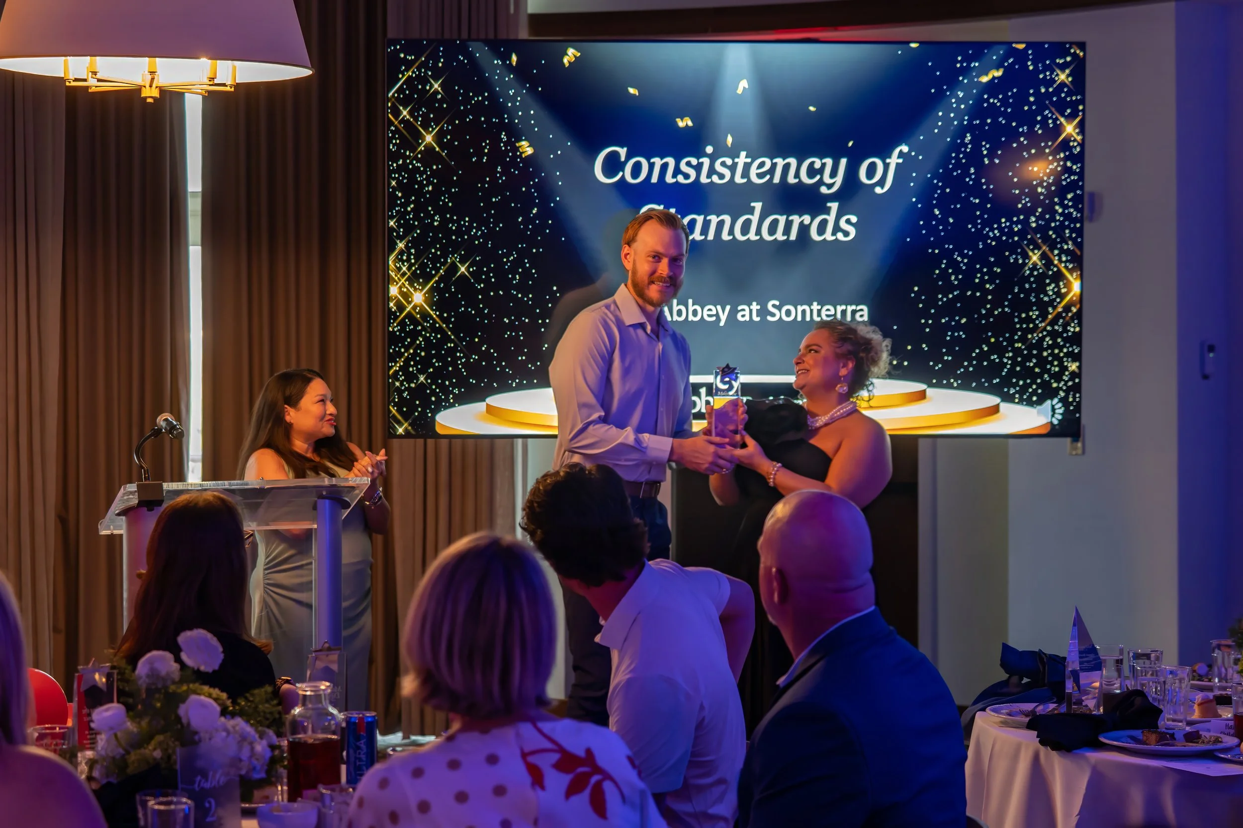 Savannah corporate event photographer capturing awards ceremony in ballroom at The Alida Hotel