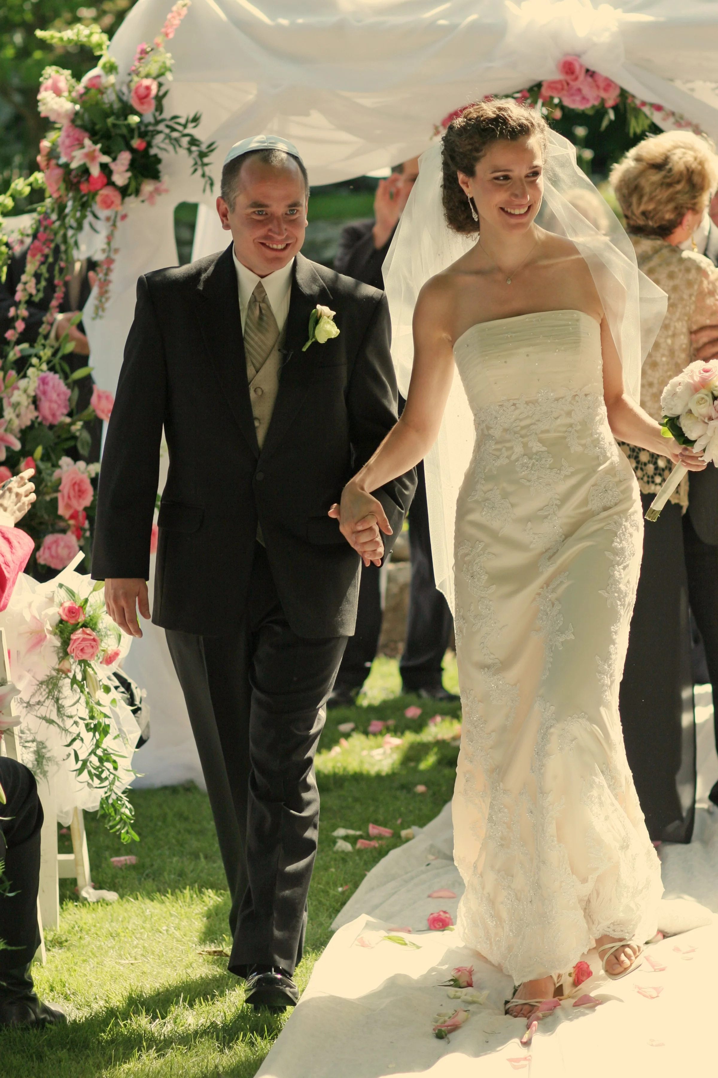 Wedding recessional bride and groom walking up aisle after ceremony at Spa at Norwich Inn