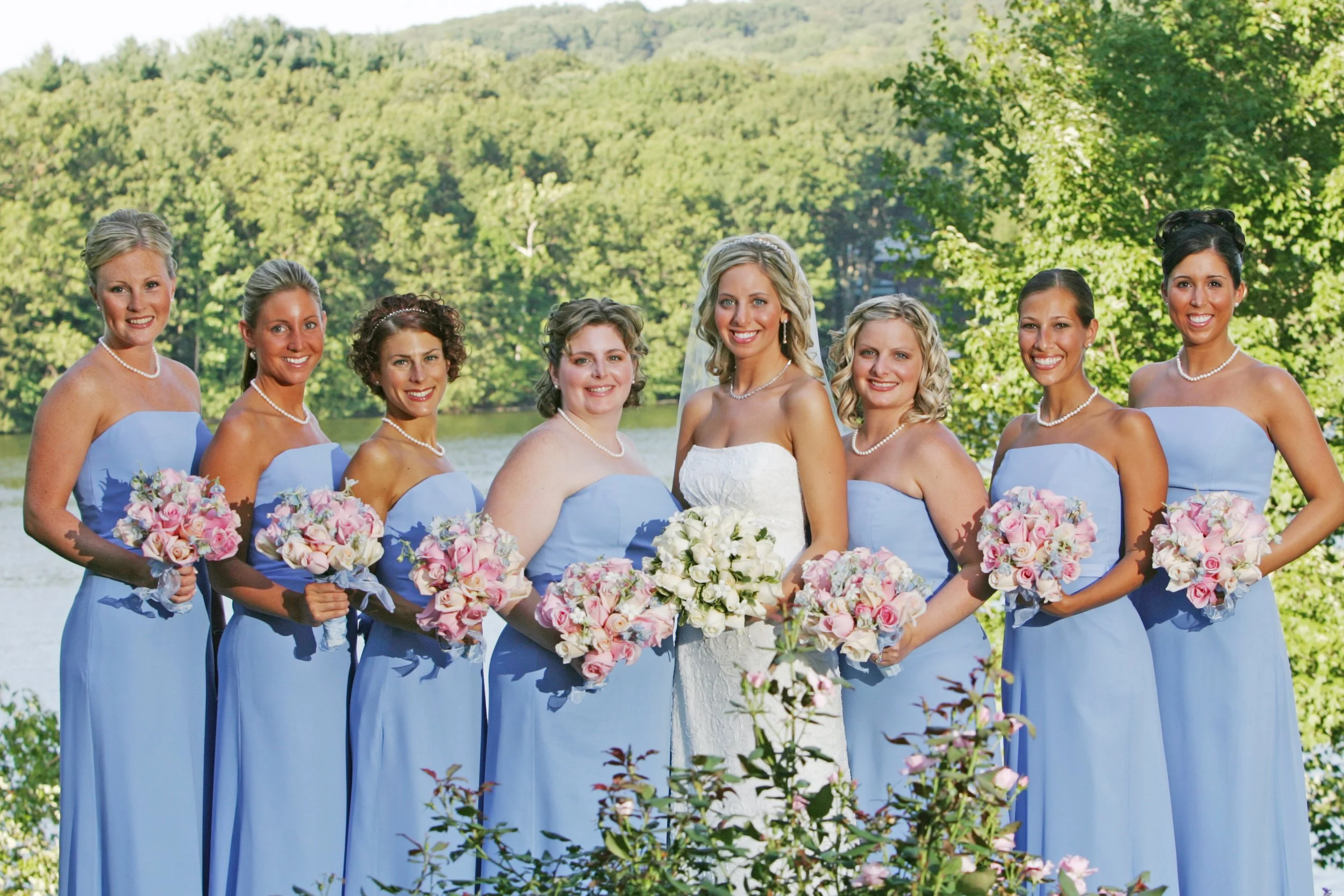 Bridesmaids portrait with seasonal flowers and Lake Zoar views at Waterview in Monroe, Connecticut