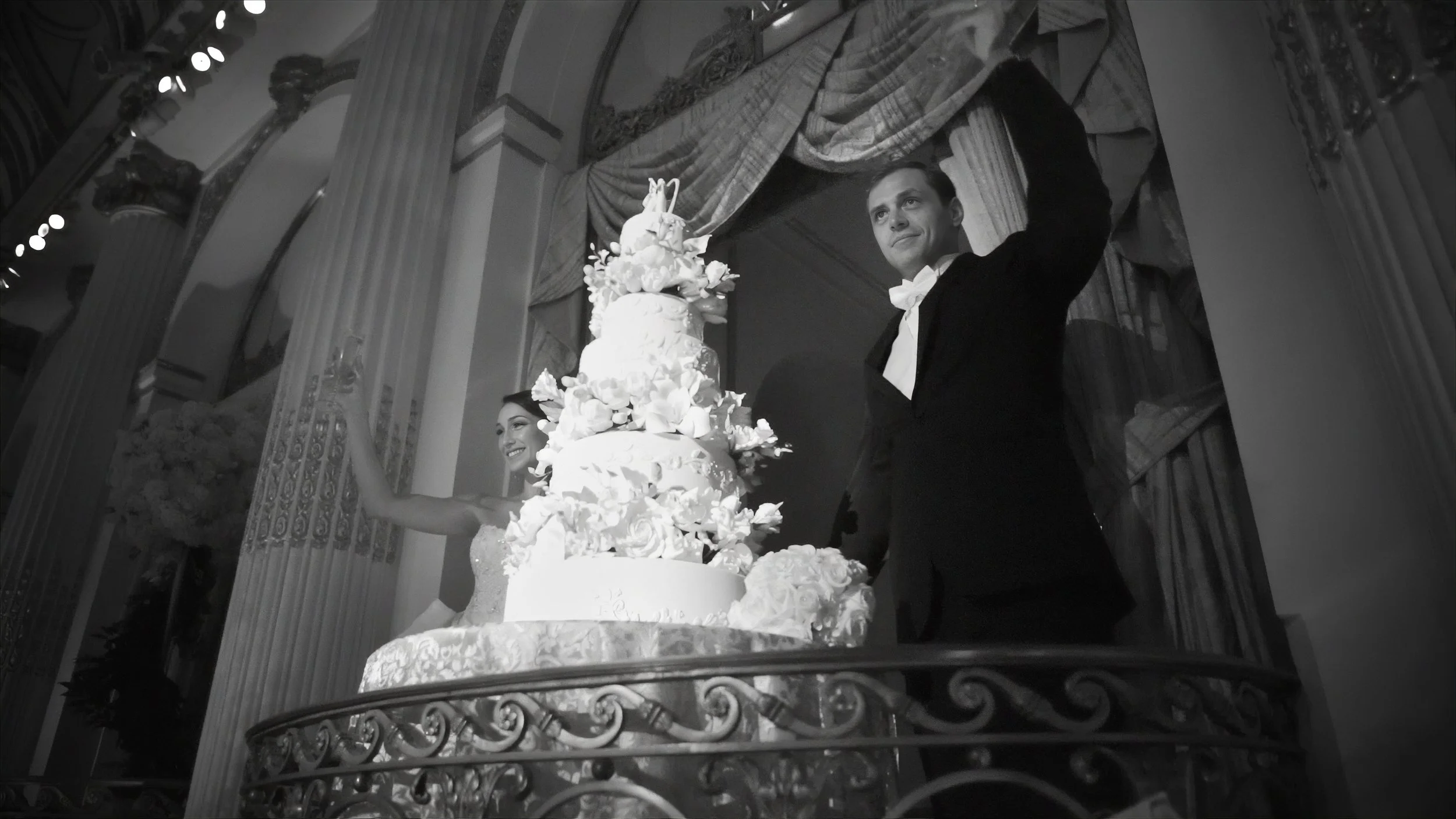 The bride and groom toast their guests at a wedding at The Plaza Hotel